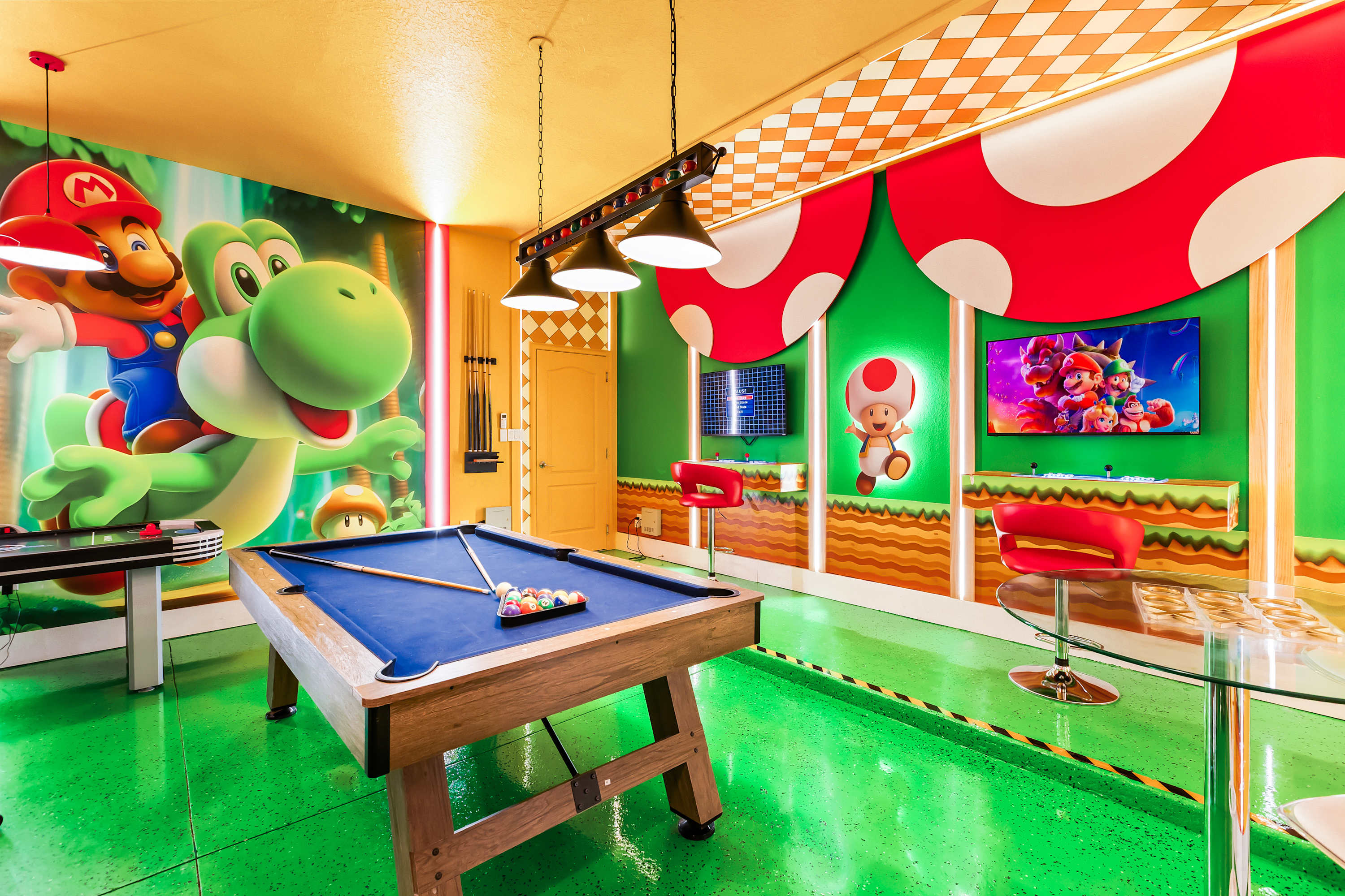 Colorful themed game room with ping pong table and fun décor.