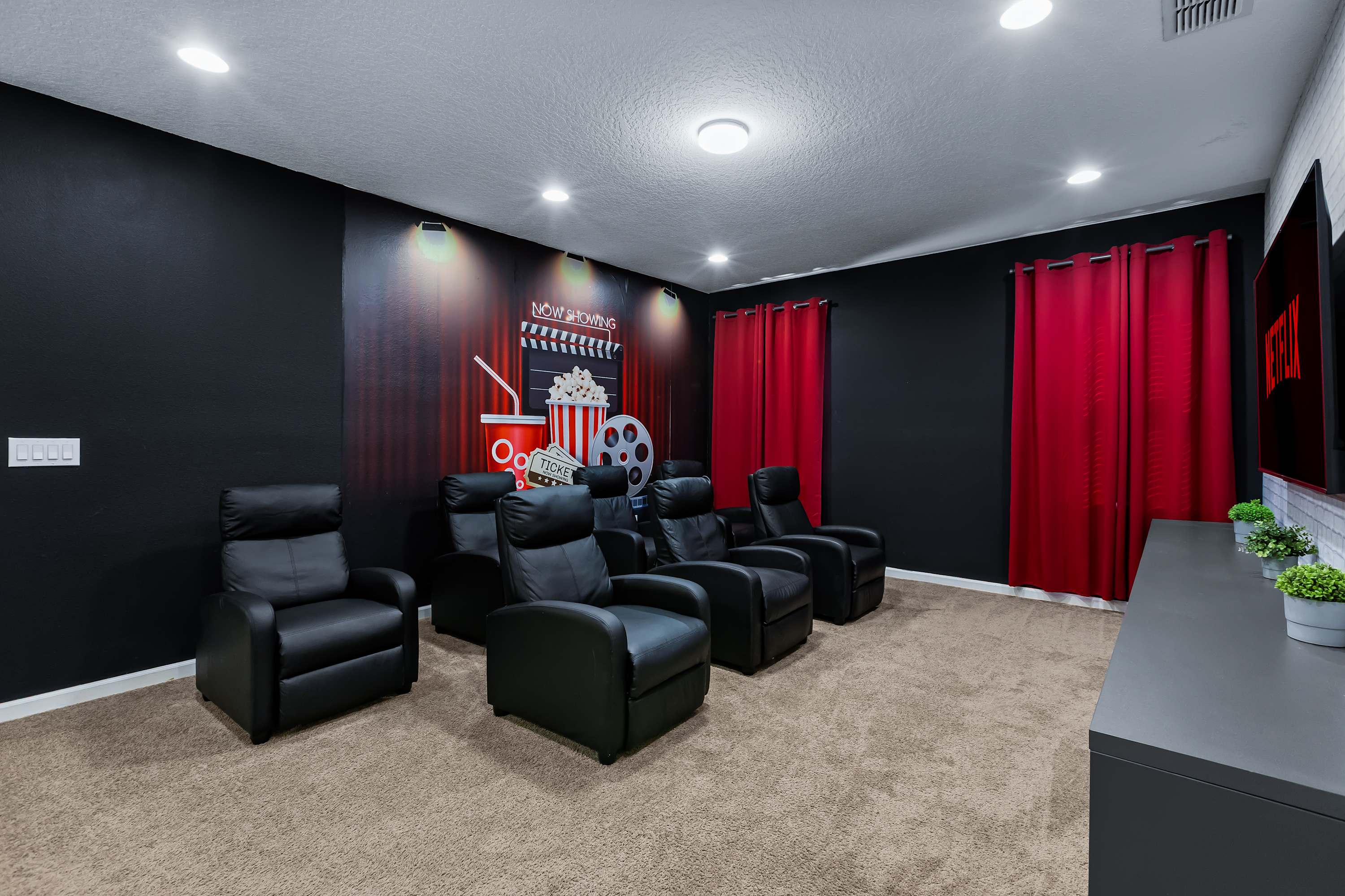 Private home theater with comfortable recliner seating.