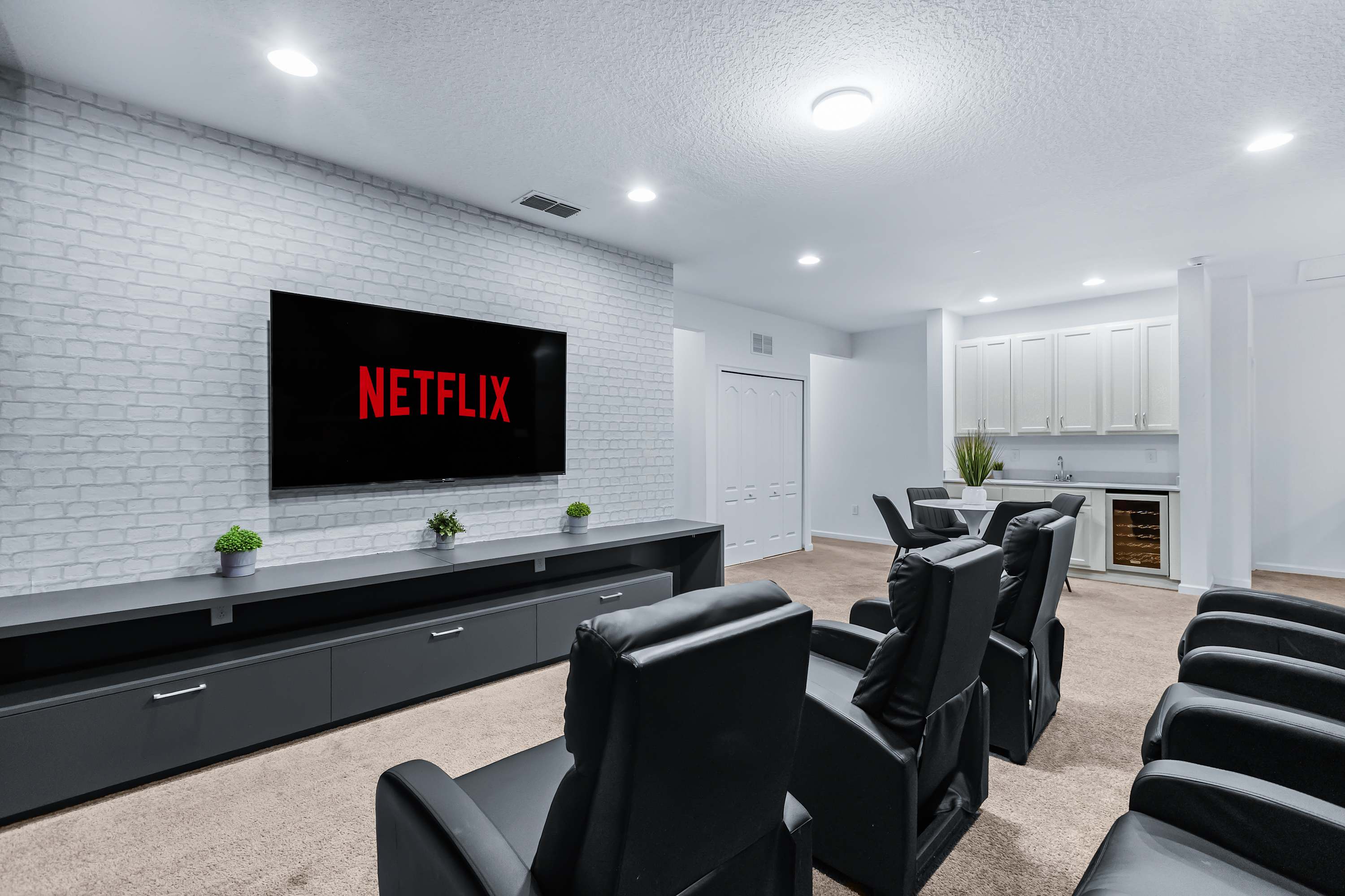 Private home theater with large screen and comfortable seating.
