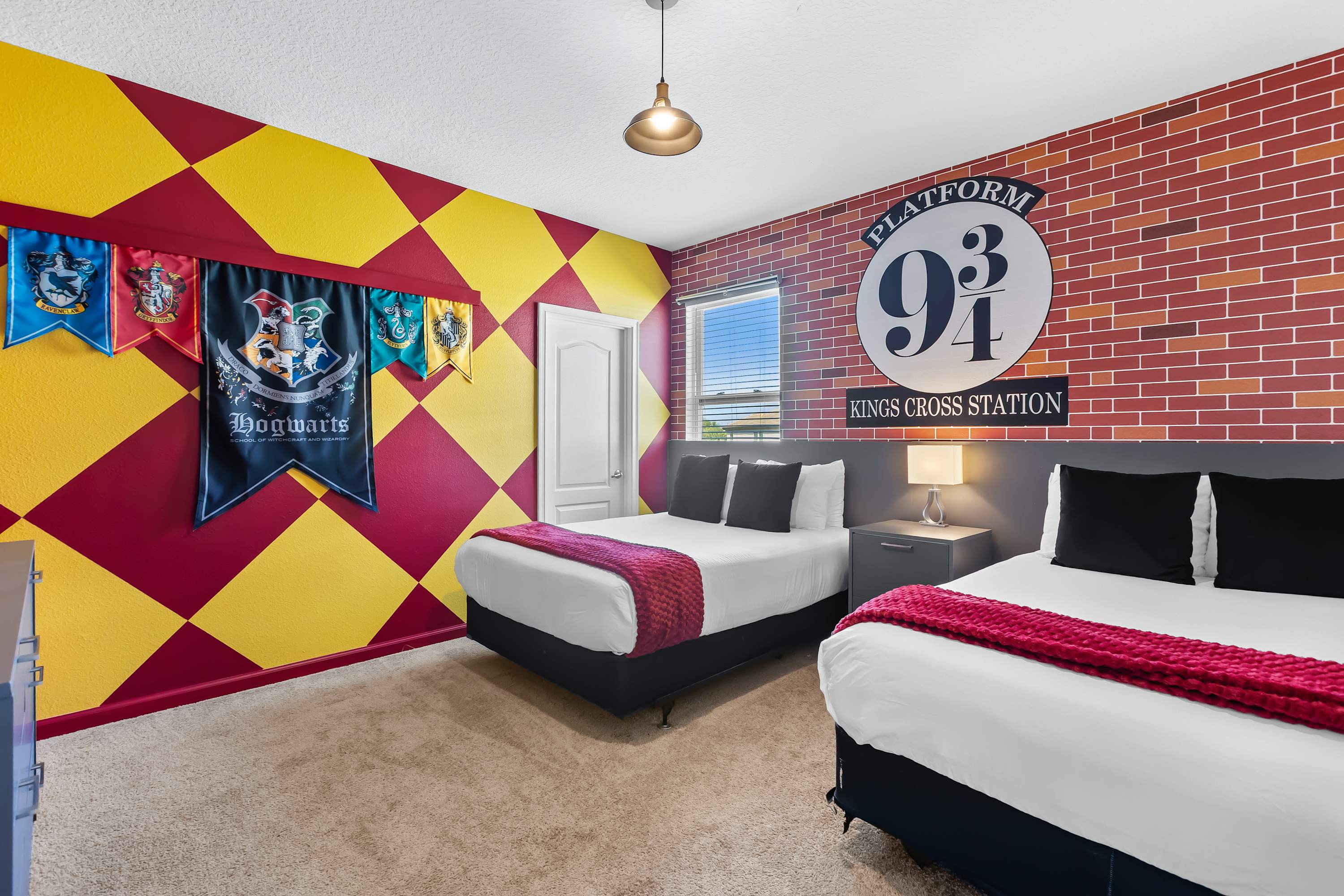 Harry Potter themed bedroom with twin beds and immersive décor.