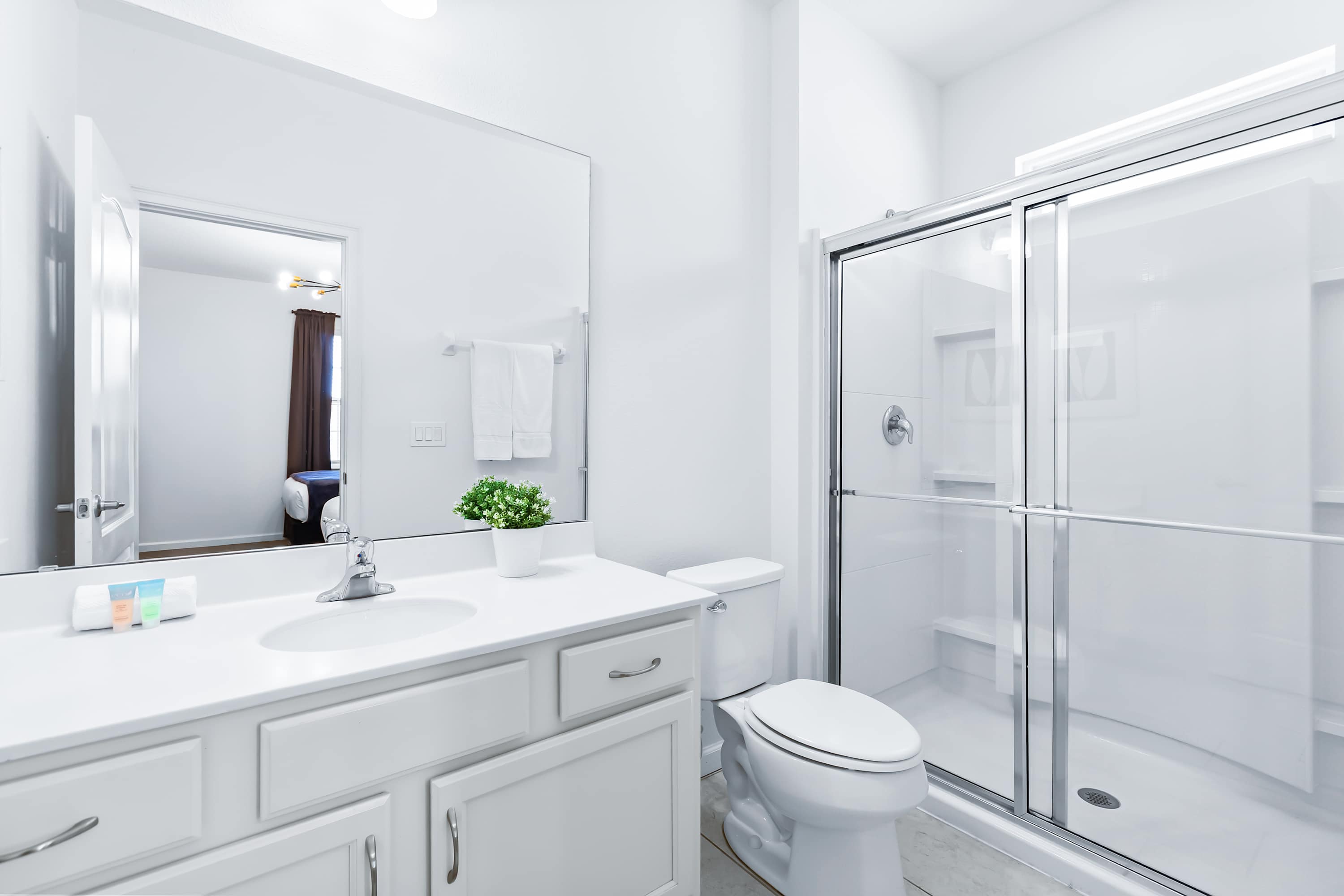 Ensuite bathroom with bright white vanity.