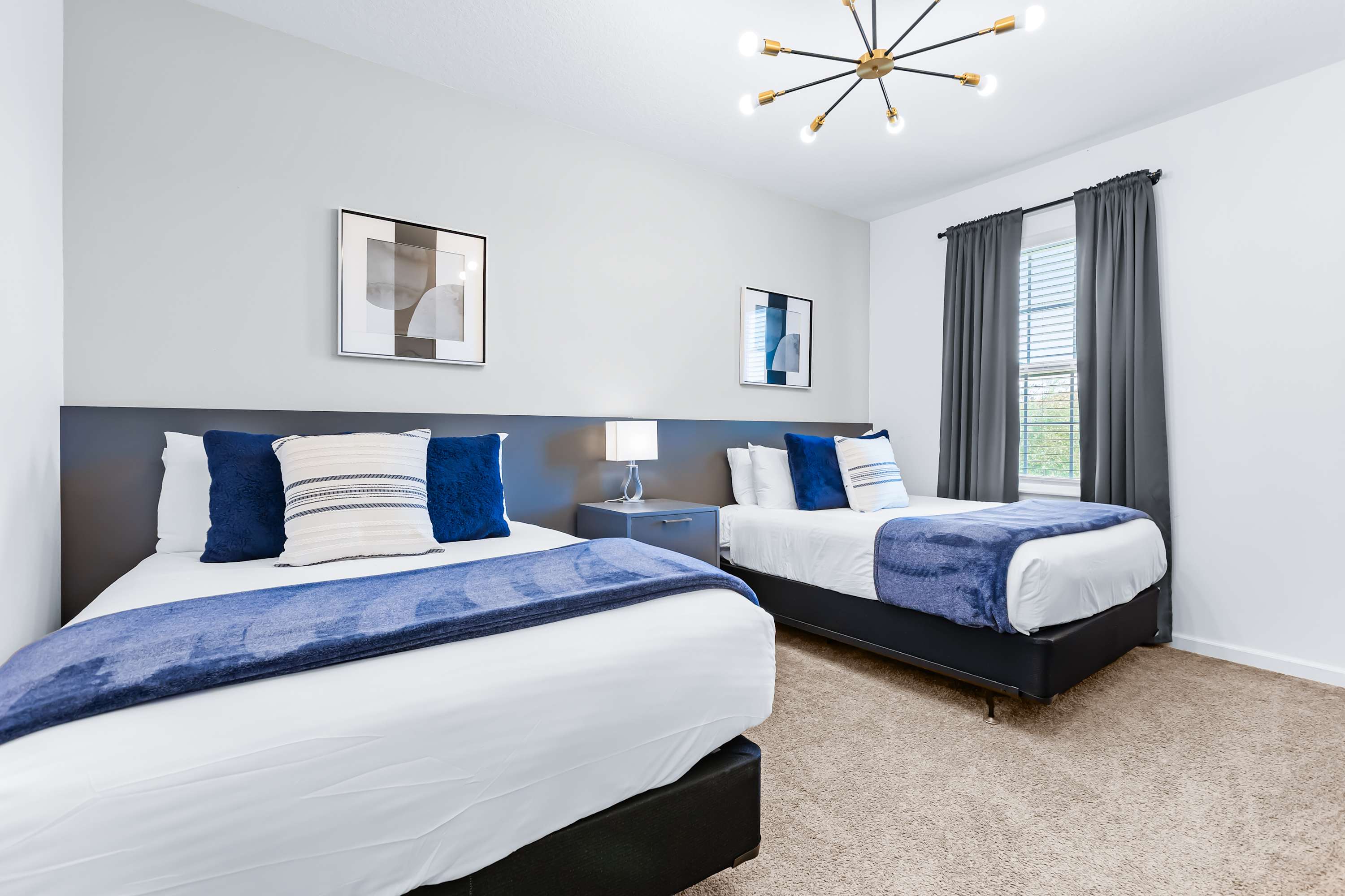 Spacious bedroom with two beds, ideal for families or groups.