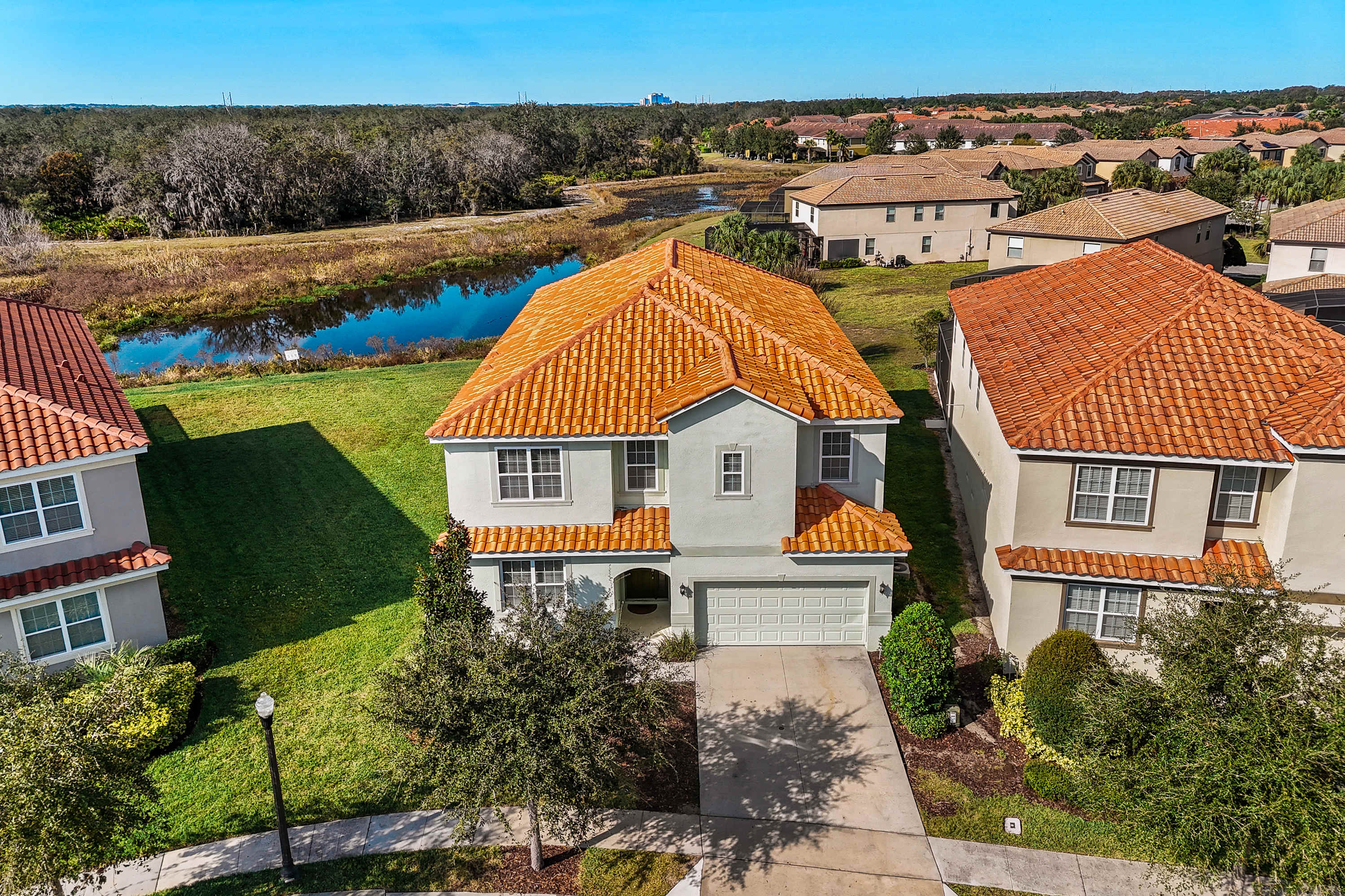 Aerial view of the home in a peaceful community setting.