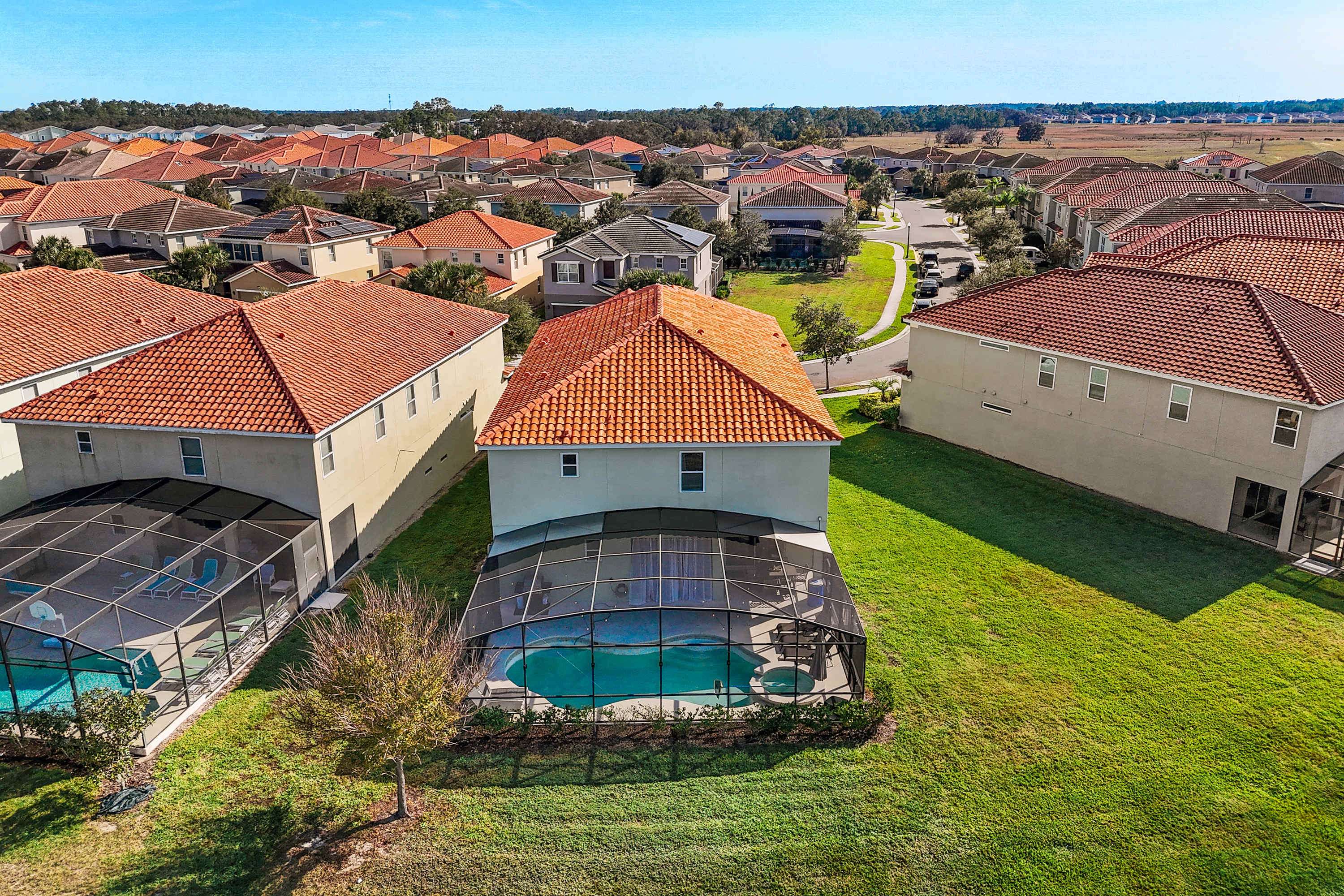 Aerial view of the home in a peaceful community setting.