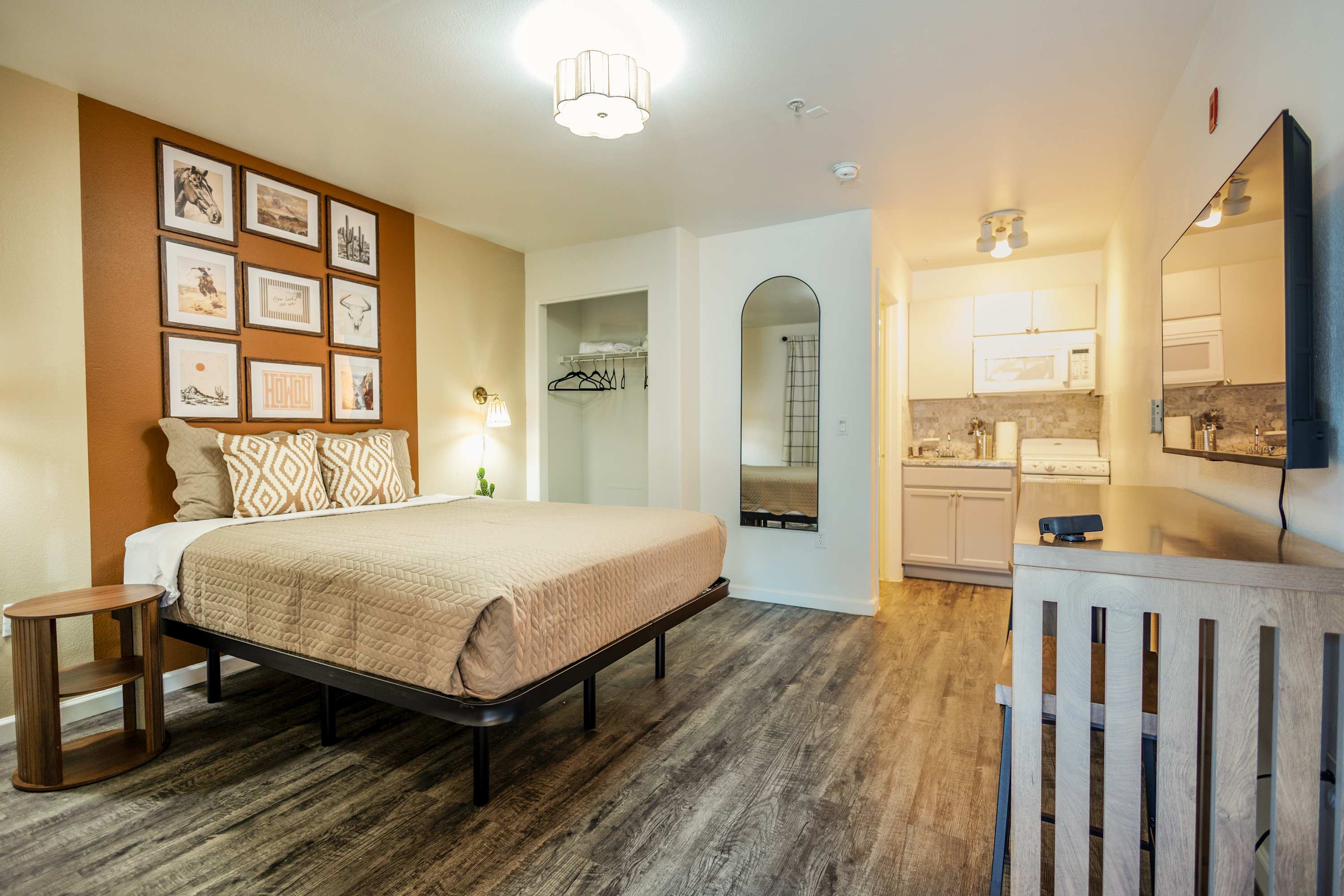 Cozy studio with modern amenities and warm decor, perfect for a relaxing stay.