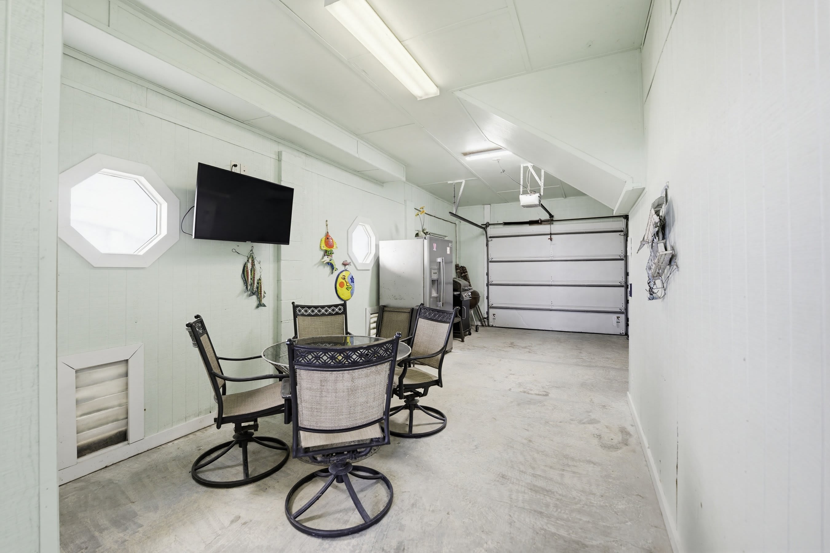 Garage with Extra Fridge, Grill, TV and Half Bath