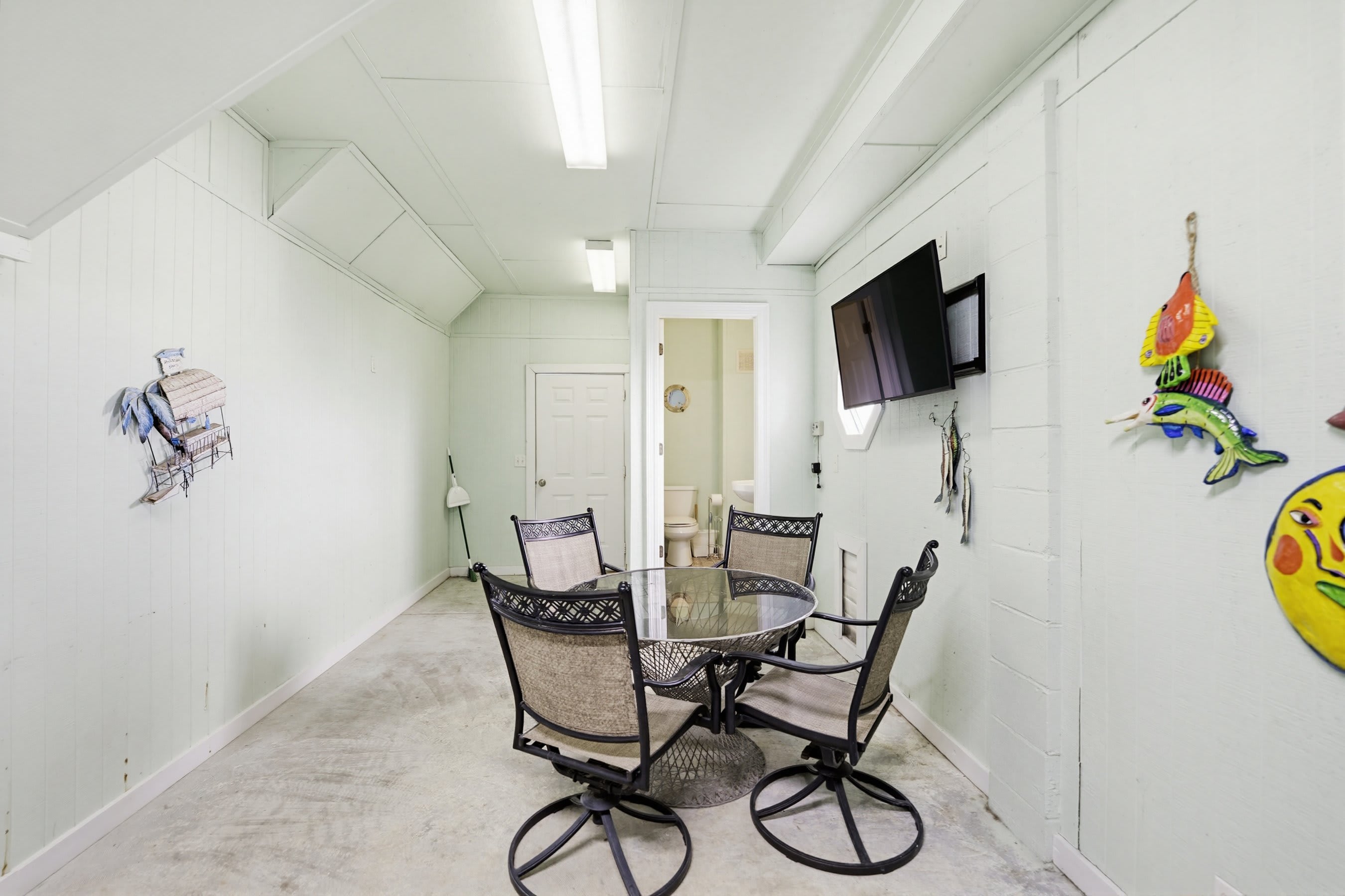 Garage with Extra Fridge, Grill, TV and Half Bath