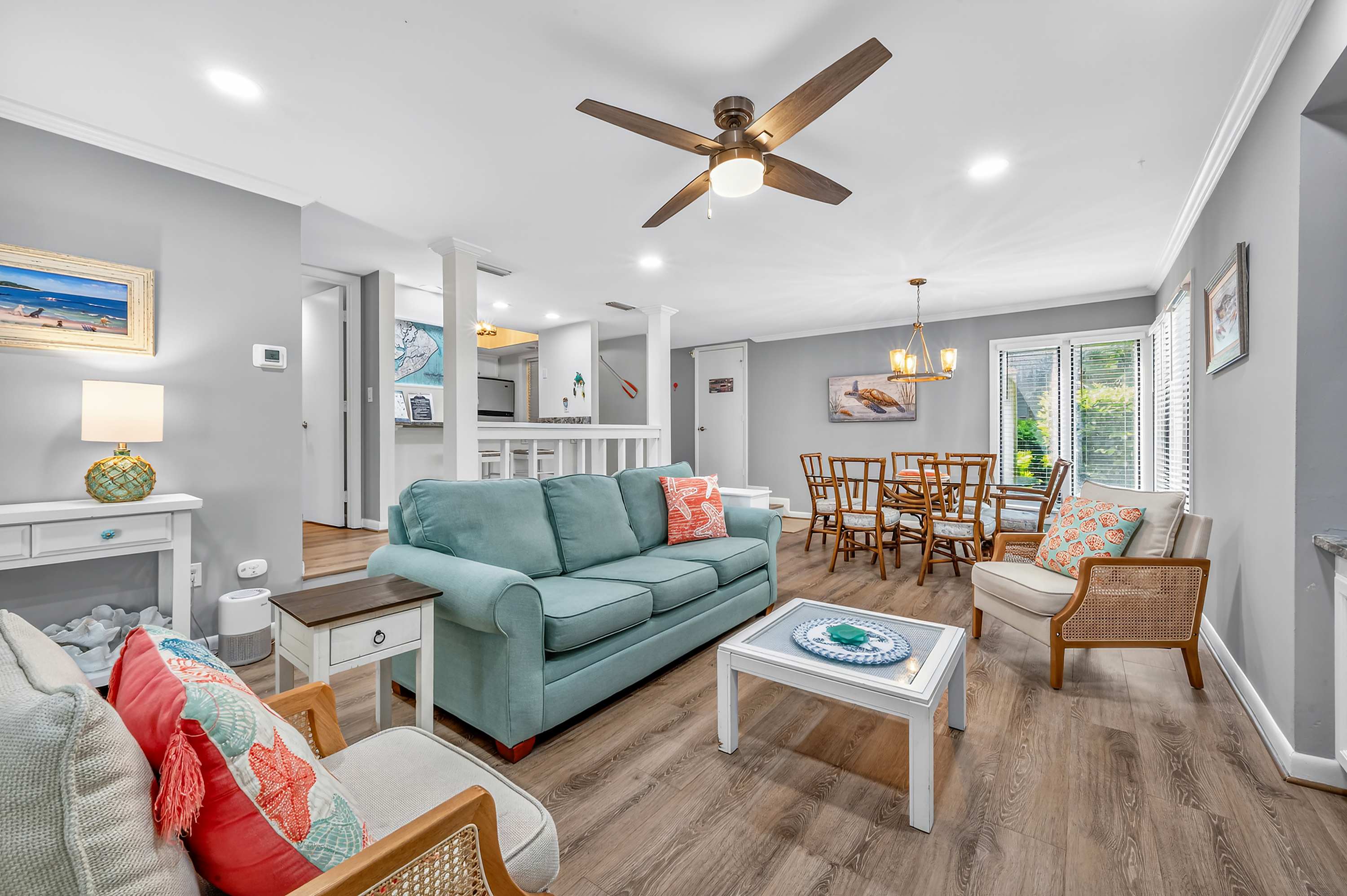 Cozy coastal-chic open living space, perfect for relaxing and group dining.