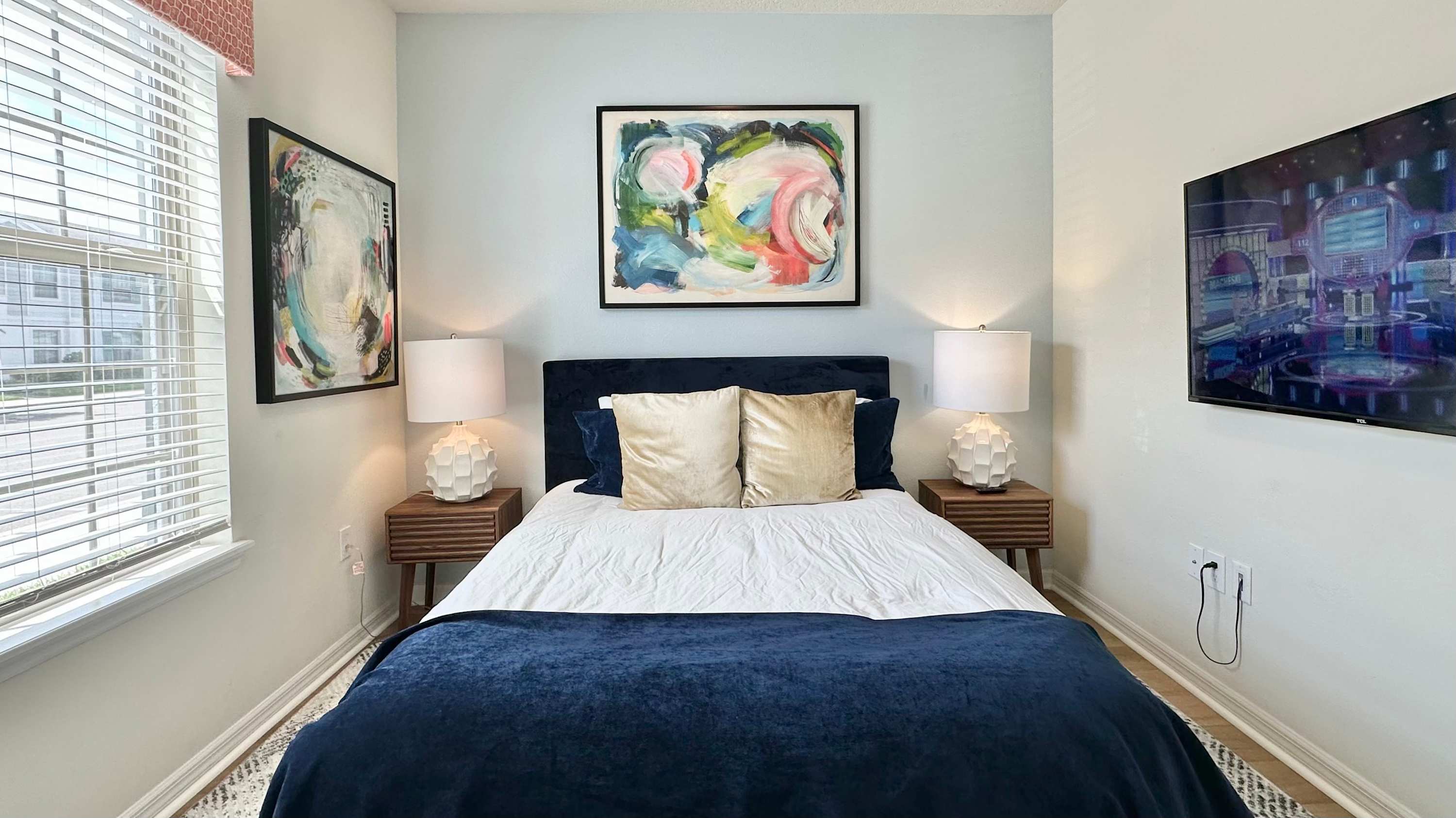 This cozy queen bedroom includes a smart TV & closet storage