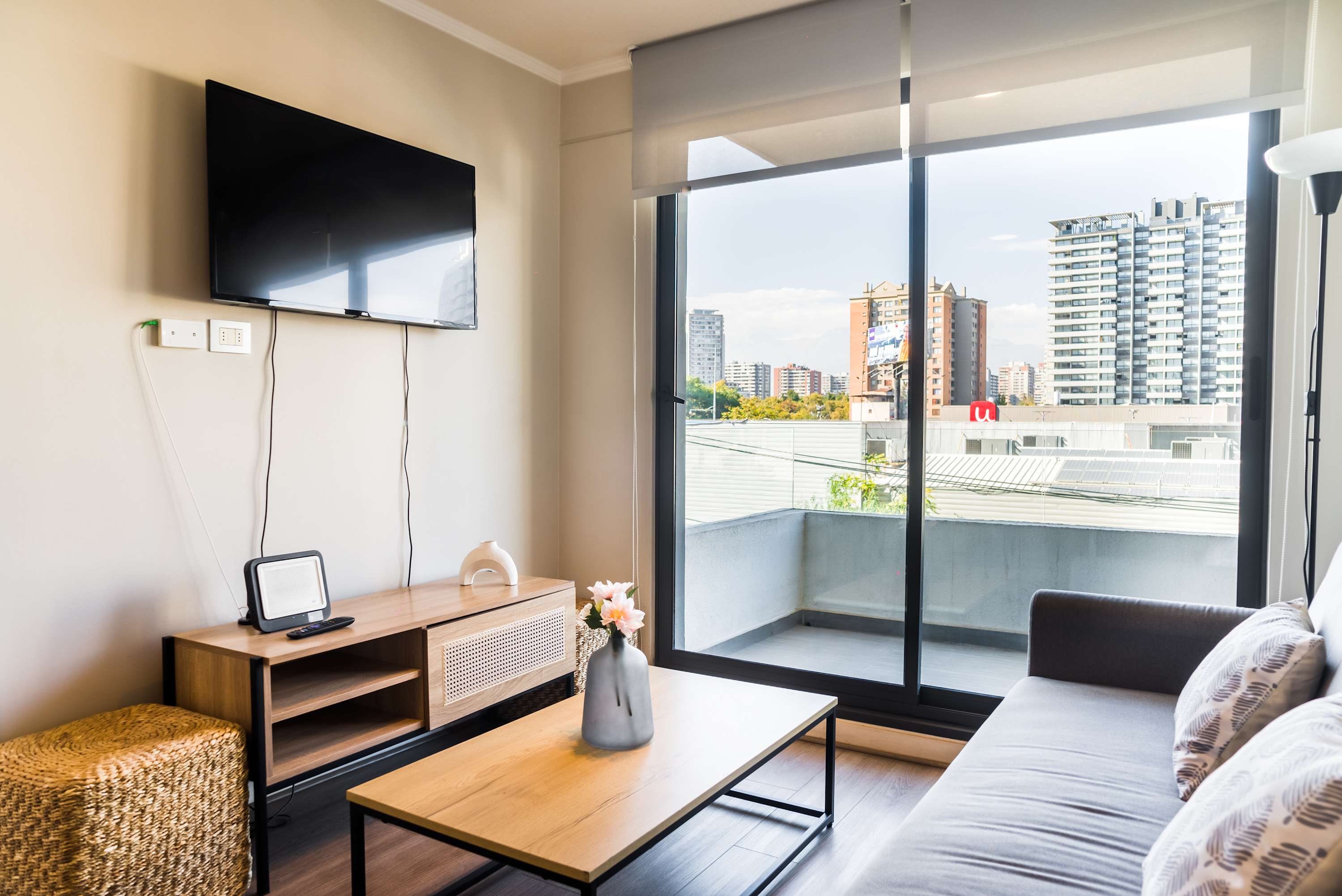 Cozy living room with city views and modern amenities, perfect for relaxation.