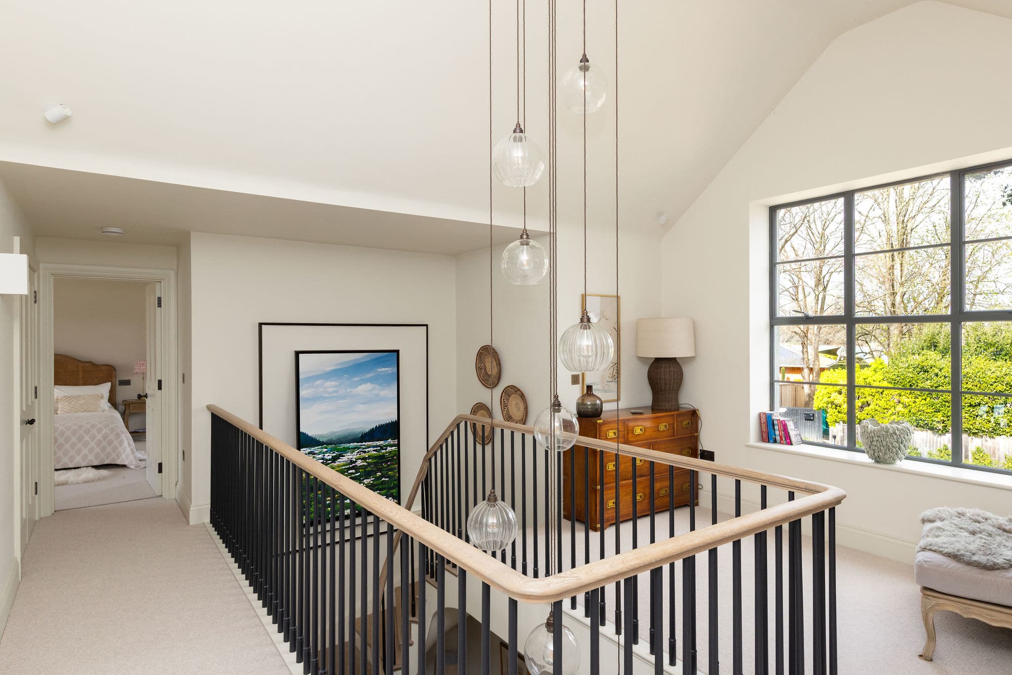Elegant landing flooded with natural light, showcasing the home's stunning architectural character throughout.