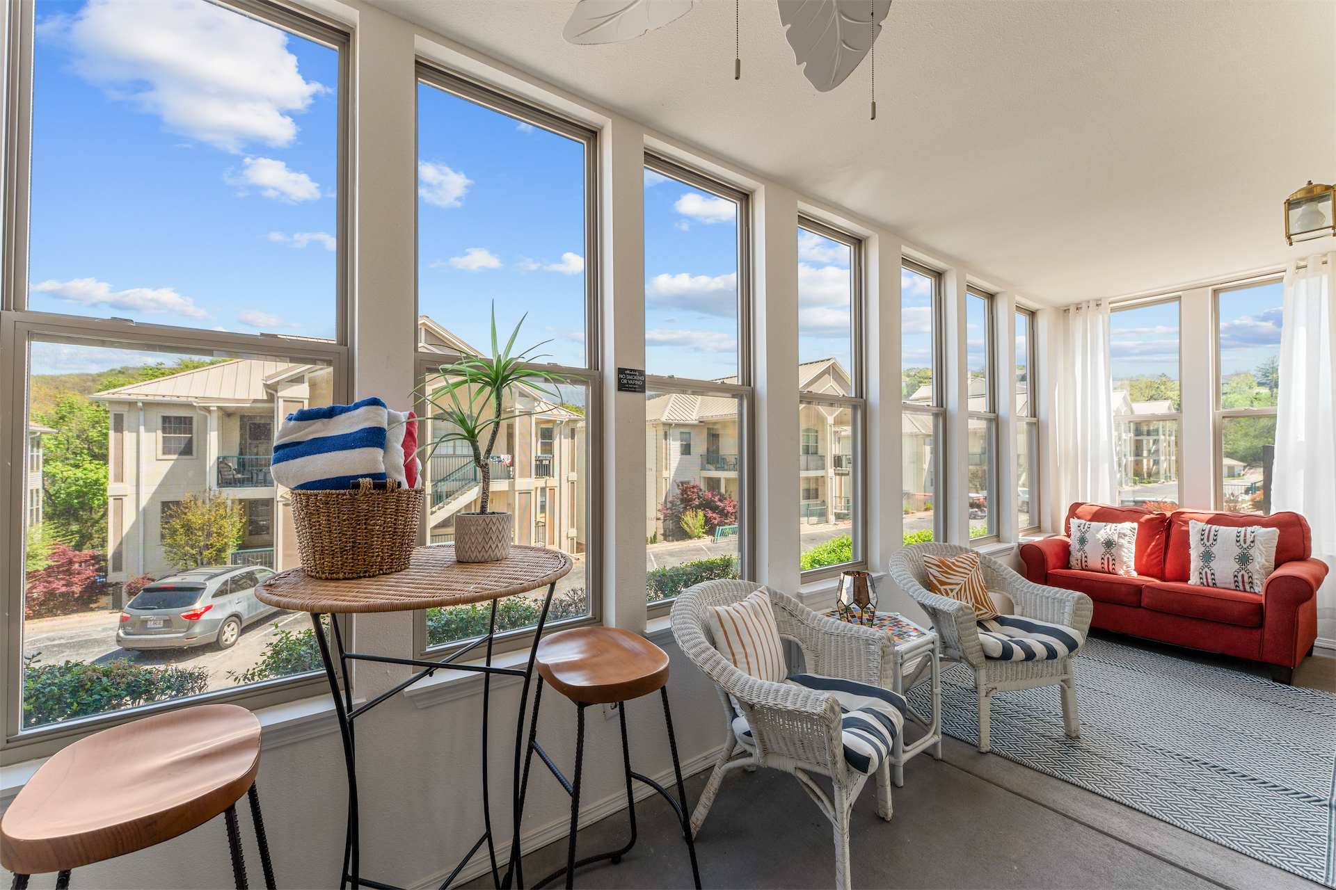 Sip morning coffee or an evening cocktail in the breezy sunroom​