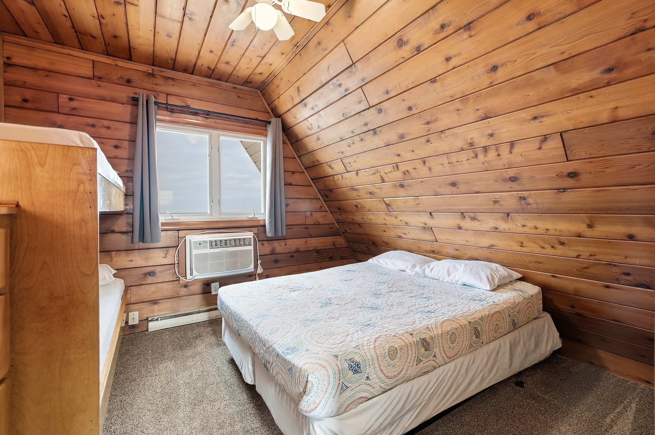 Bedroom 1 is on the upper level and has a queen and a single bunk bed.