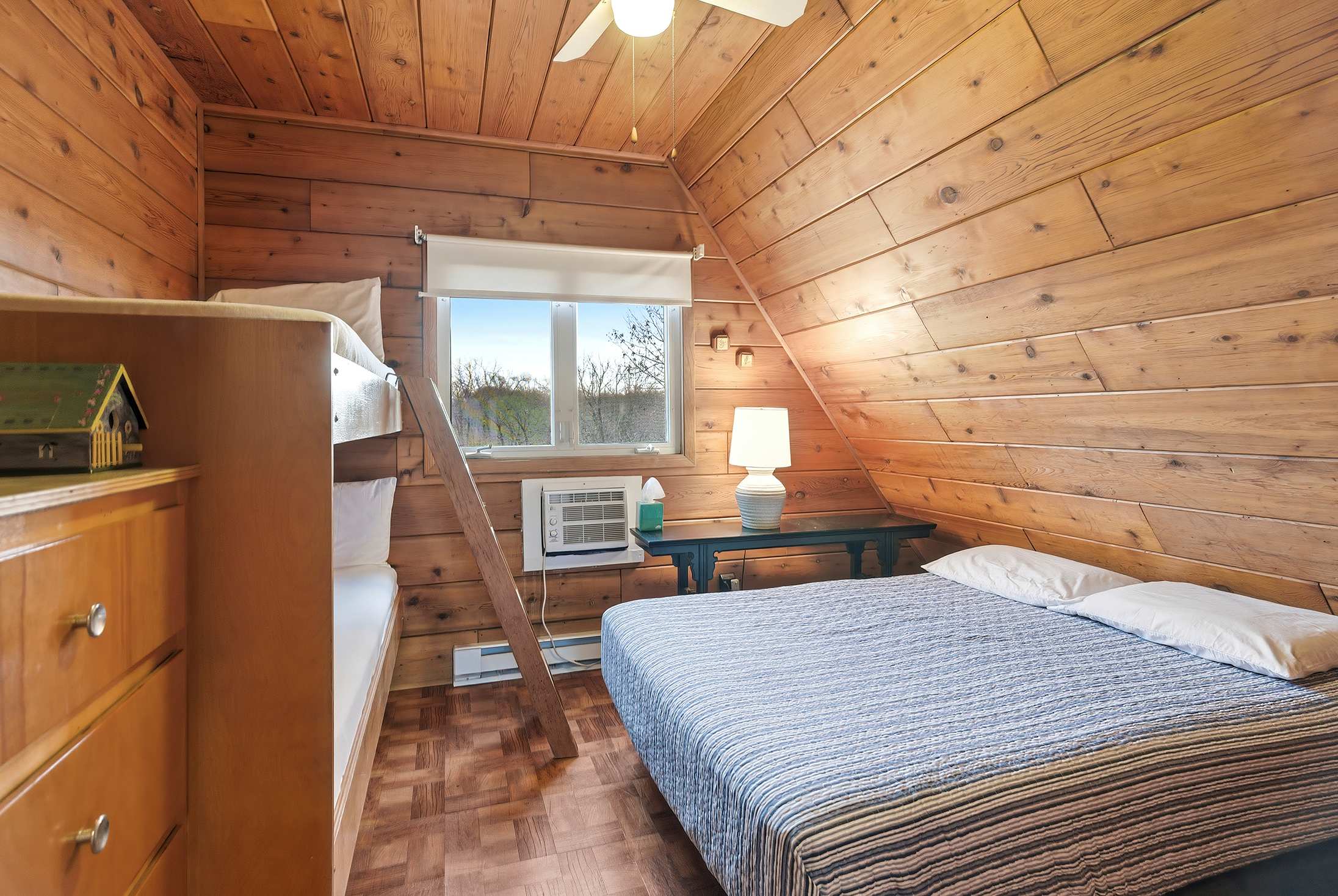 Bedroom 1 is on the upper level and has a queen and a single bunk bed.