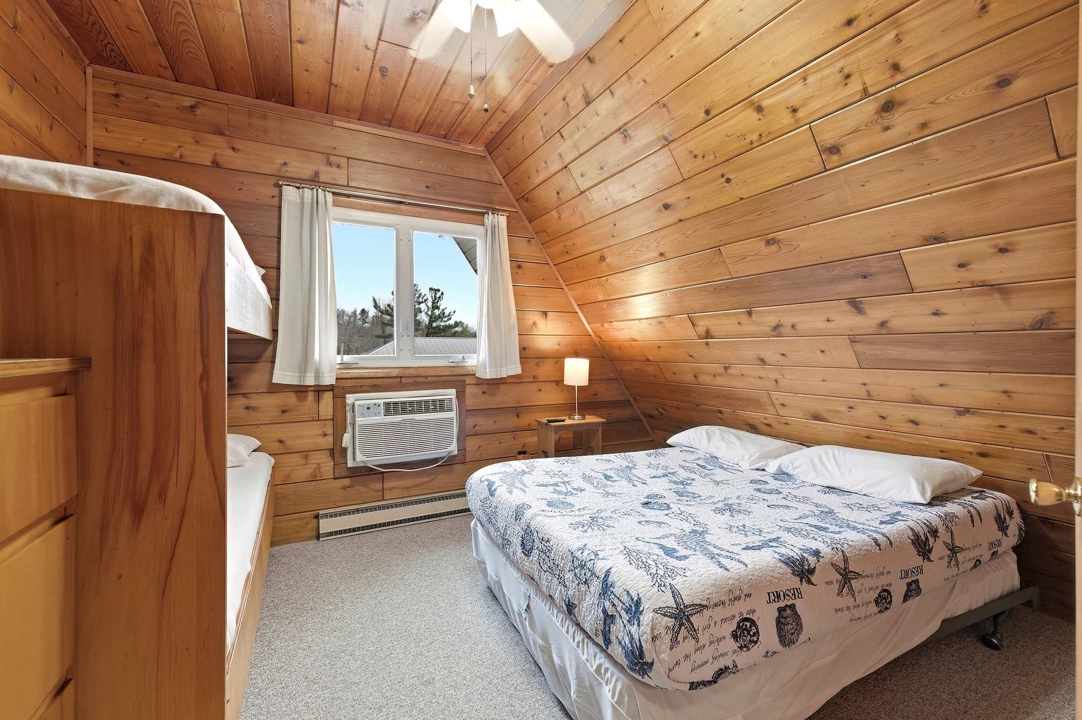 Bedroom 1 is on the upper level and has a queen and a single bunk bed.