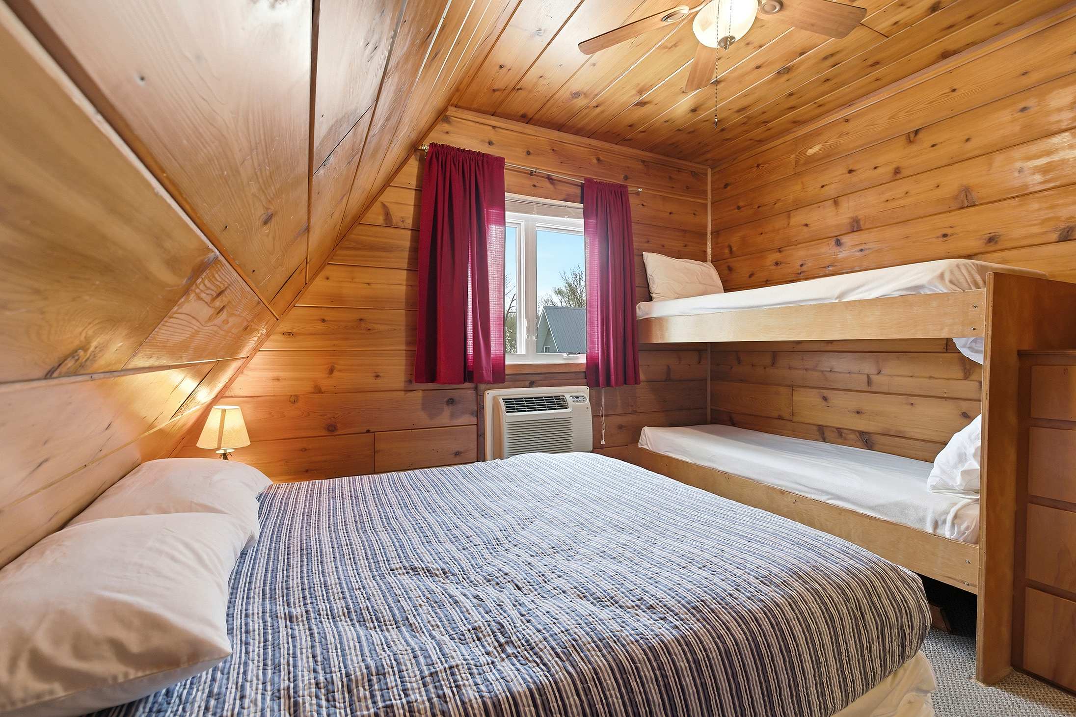 Bedroom 2 is on the upper level and has a queen and a single bunk bed.
