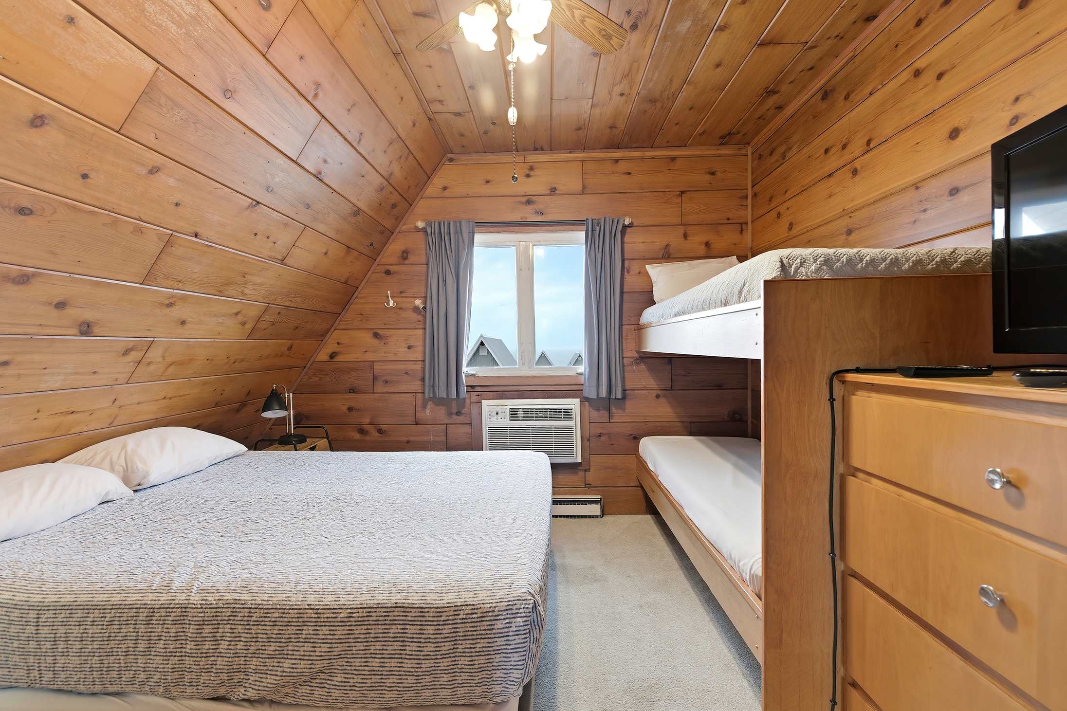 Warm walls, soft light, and a window worth waking up to.