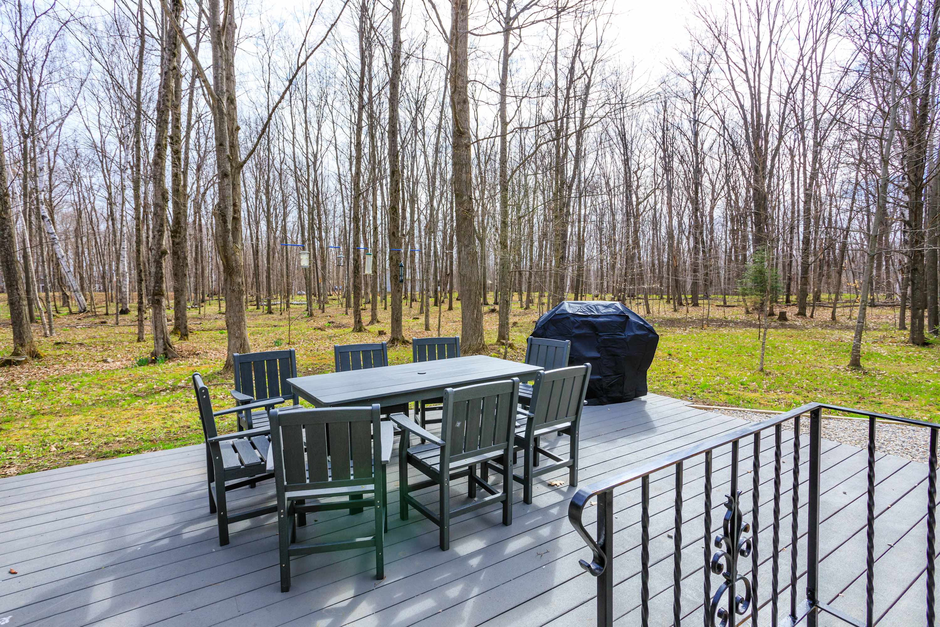 Back deck- Patio table with 8 chairs Propane grill
