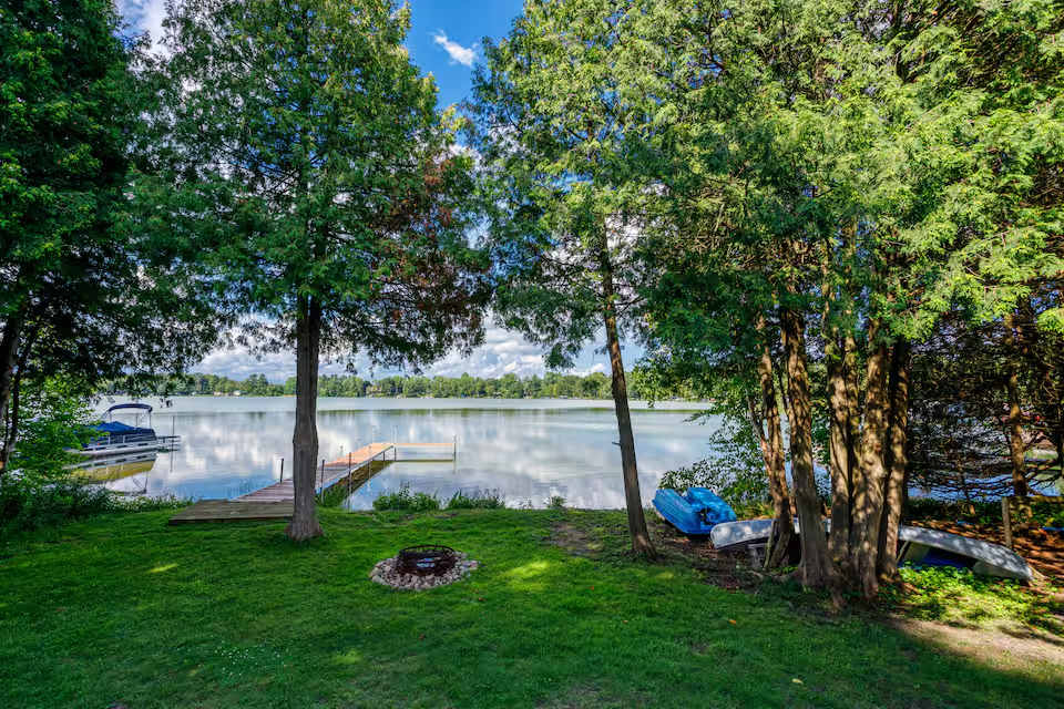 Private lake front with permanent dock, bonfire pit and several water vessels provided