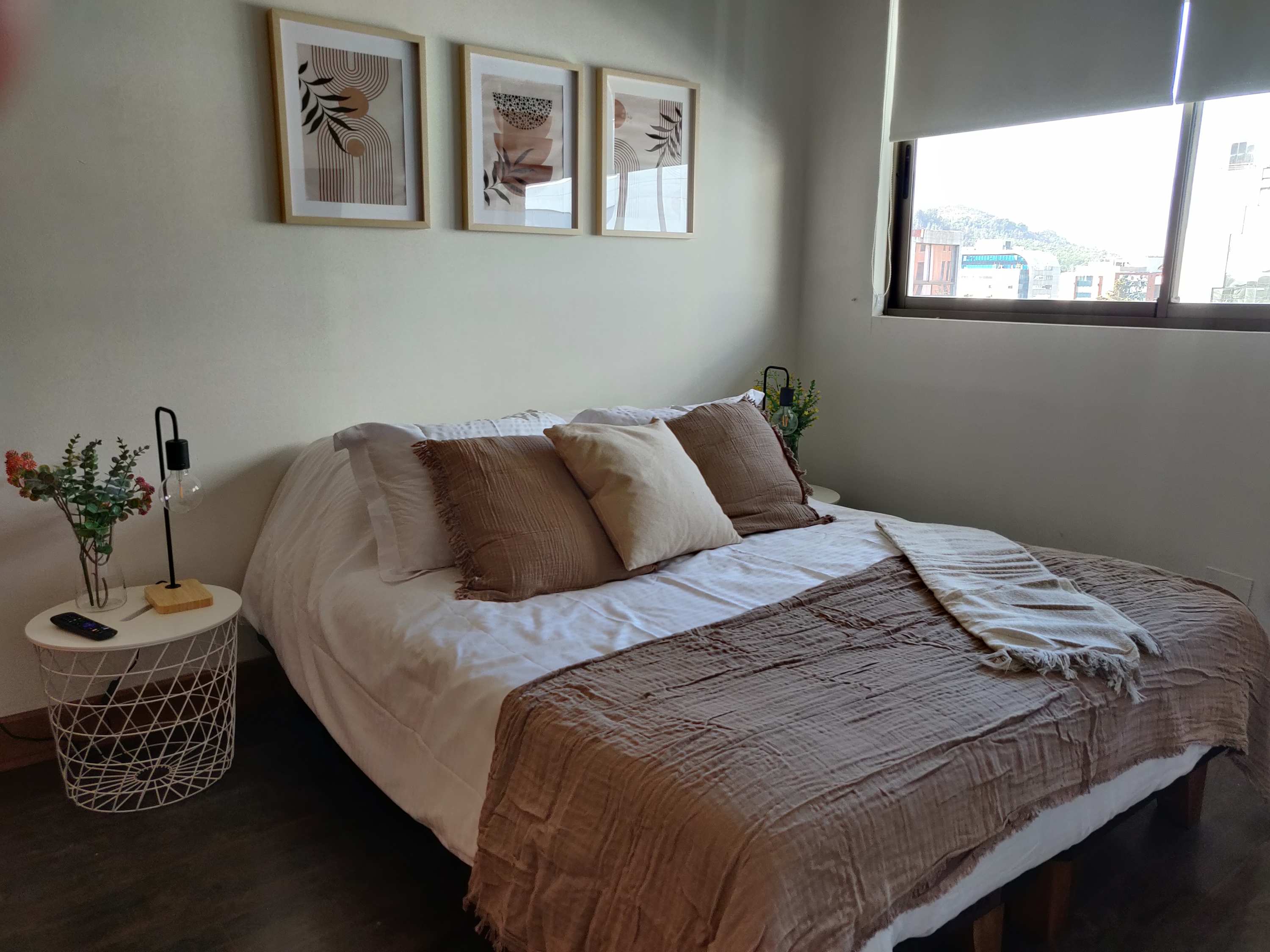 Relax in this cozy bedroom with stylish decor and a comfortable bed, perfect for unwinding after exploring the city.