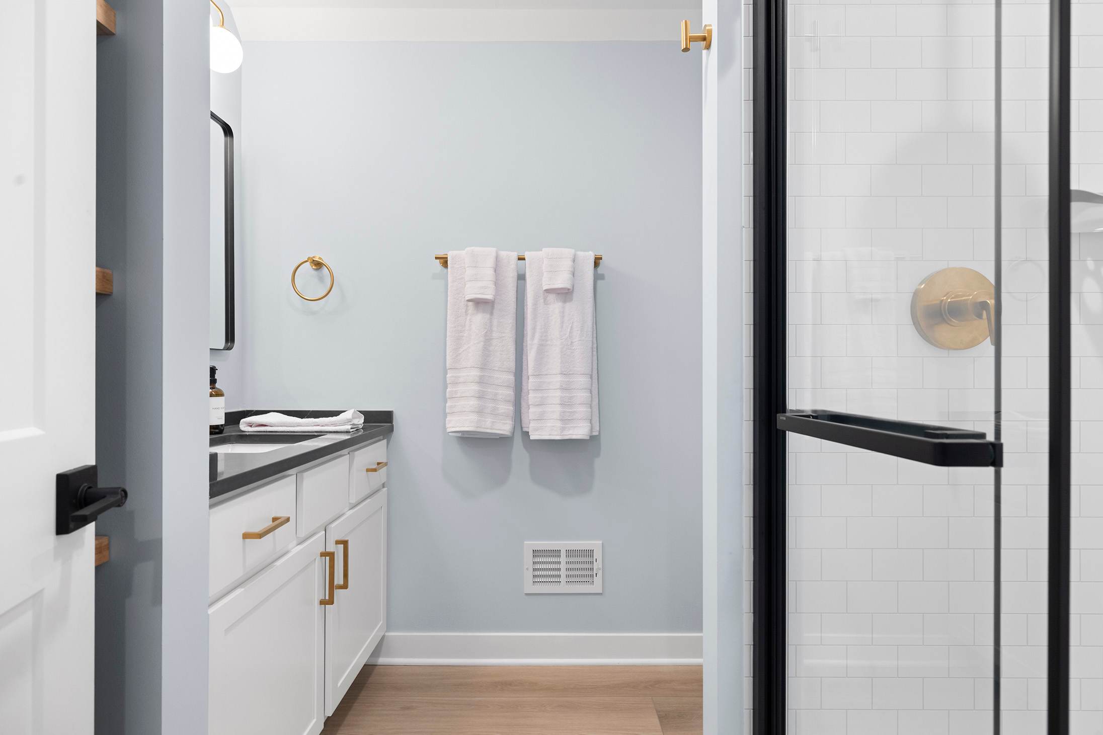 Enjoy a soothing shower in this bright and polished bathroom retreat.