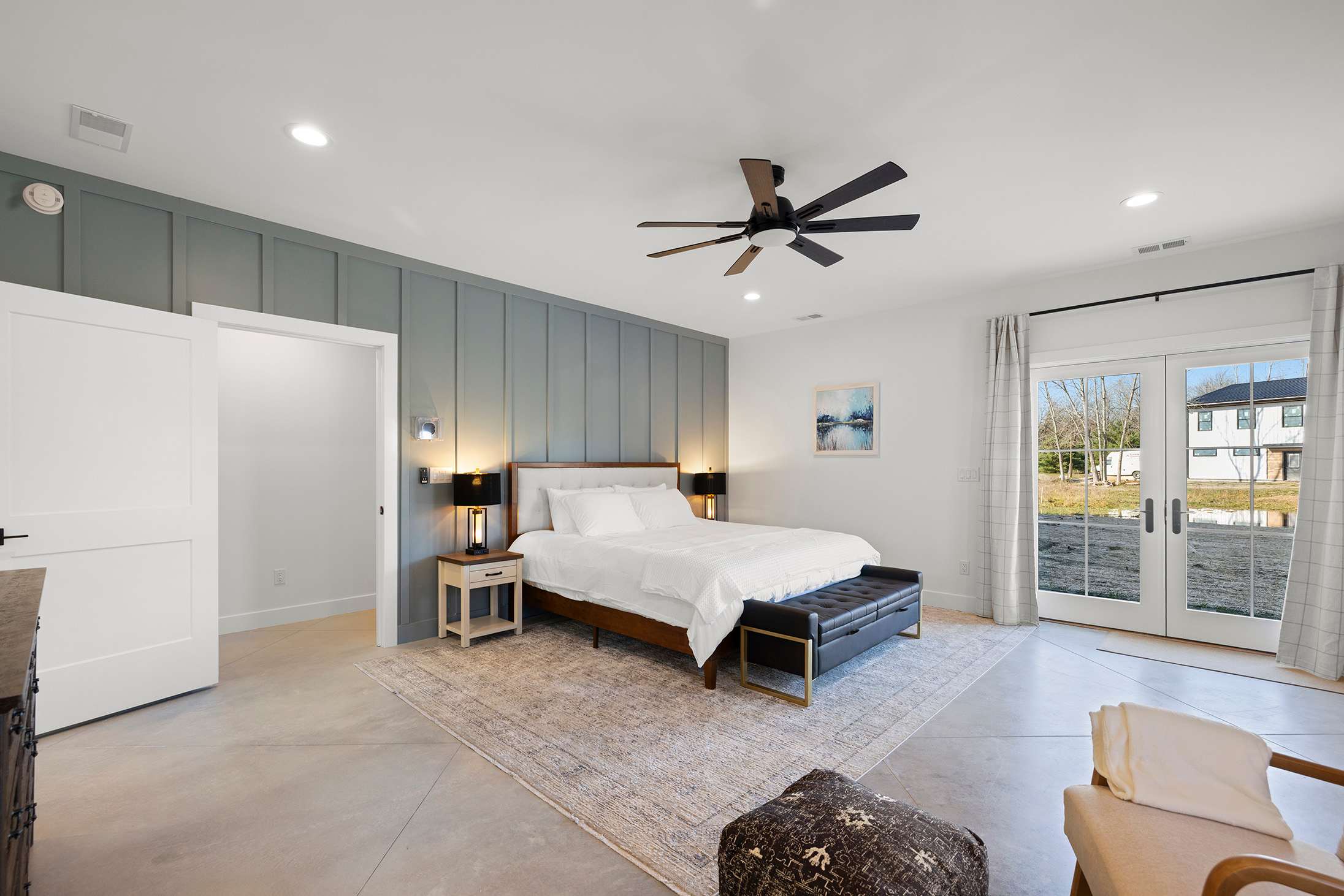 Primary bedroom is on the lower level and has a king-size bed.