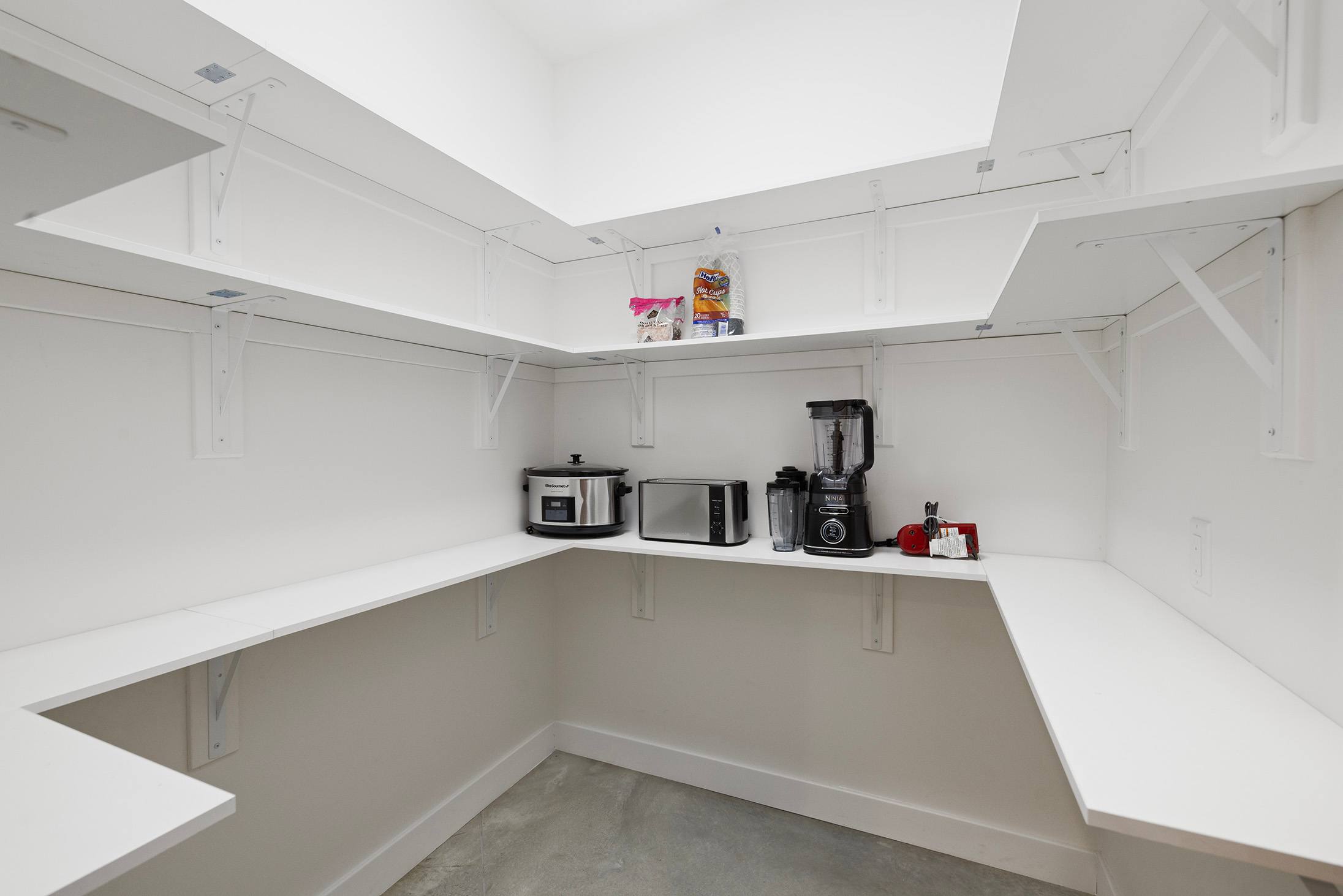 Clean and expansive pantry ready for family meals and longer stays.