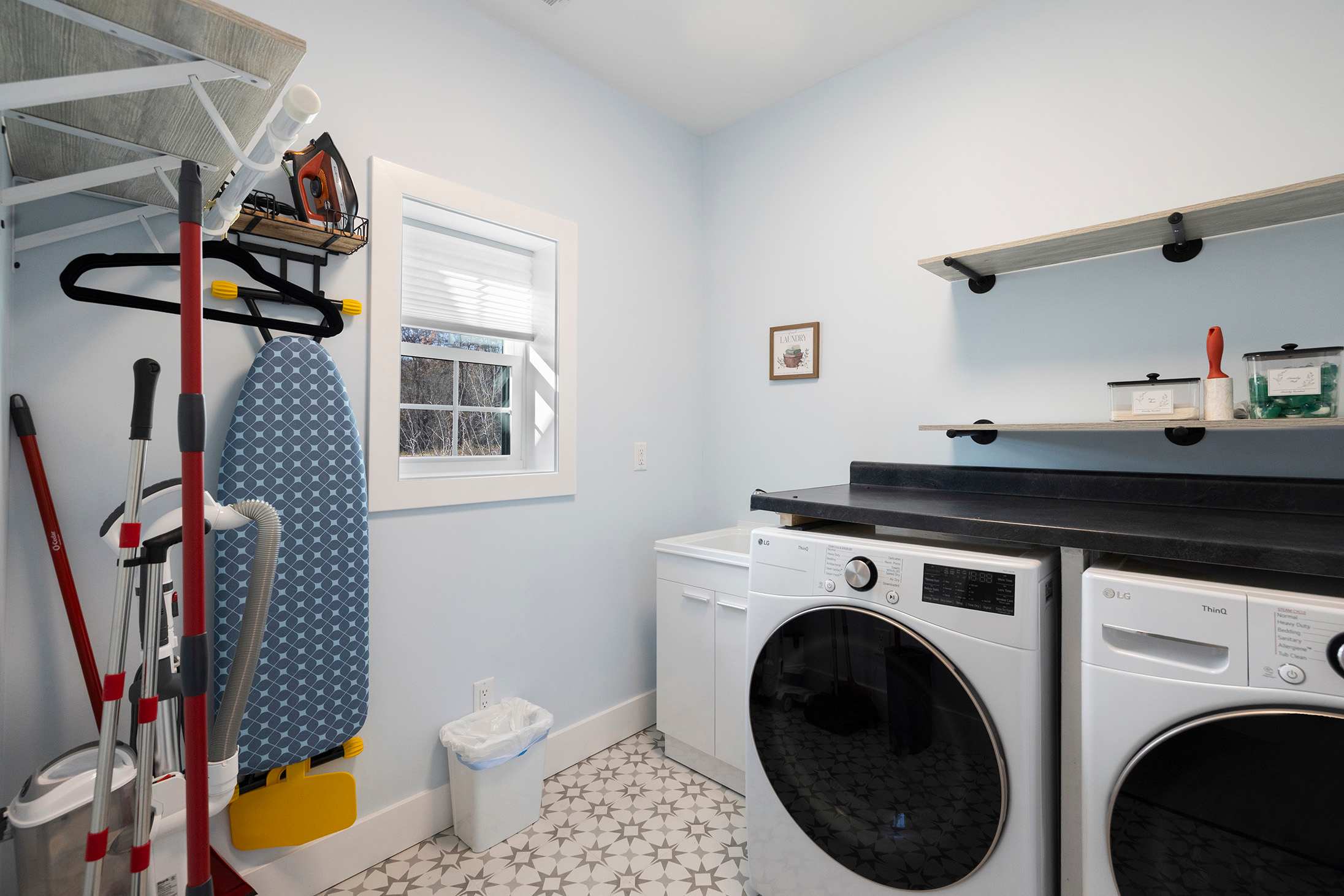 Main-level laundry room designed to keep stays effortless and organized.