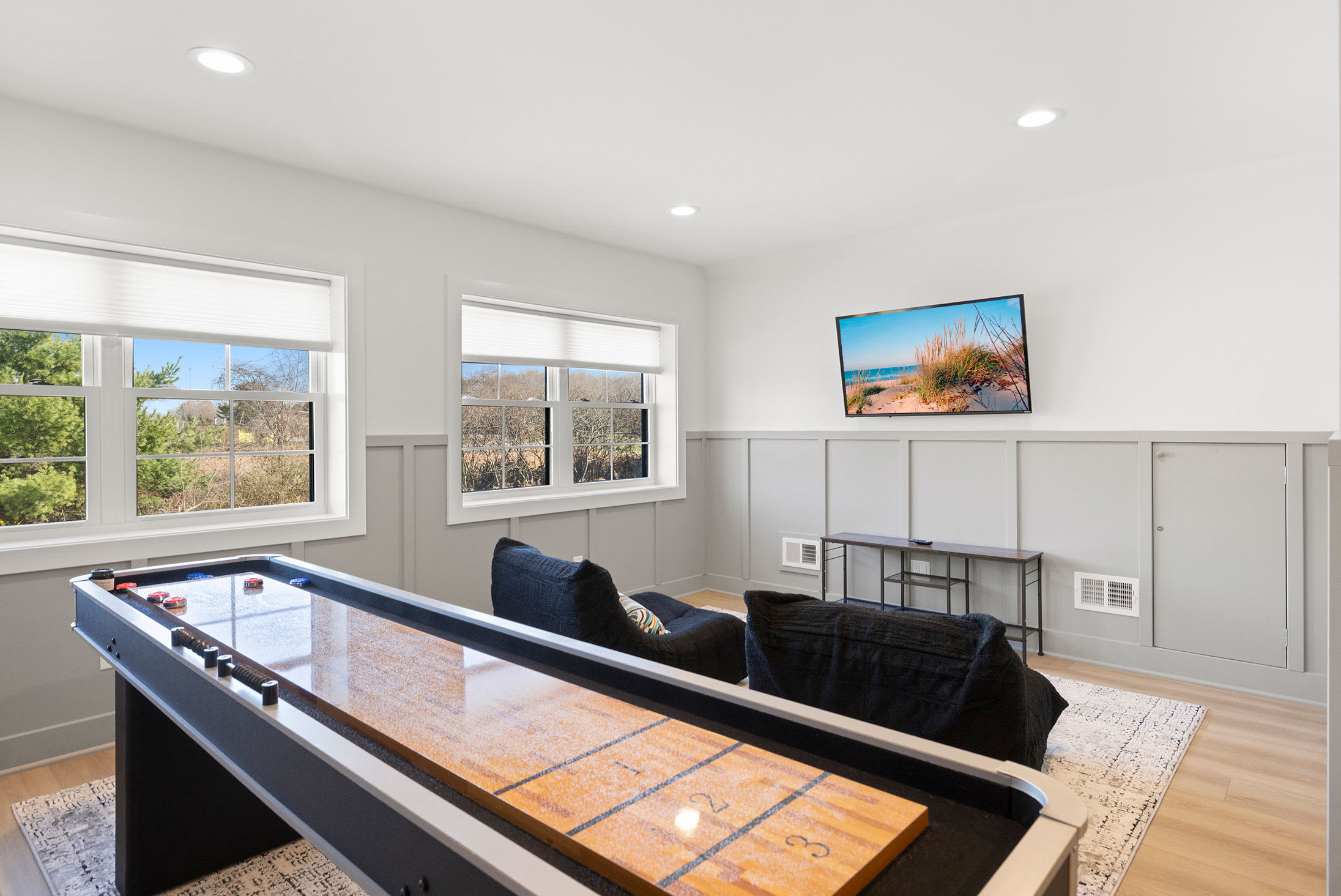 Enjoy sunny views while playing shuffleboard and watching a movie.