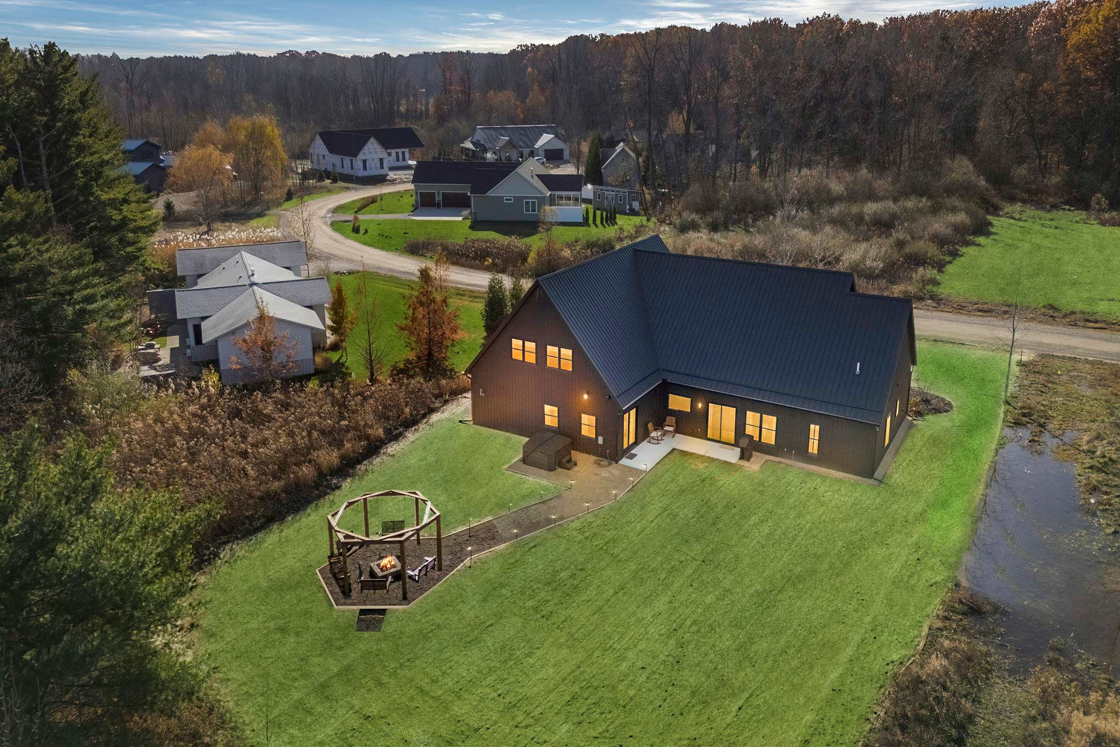 Peaceful Harbert retreat where evenings glow softly around the fire.