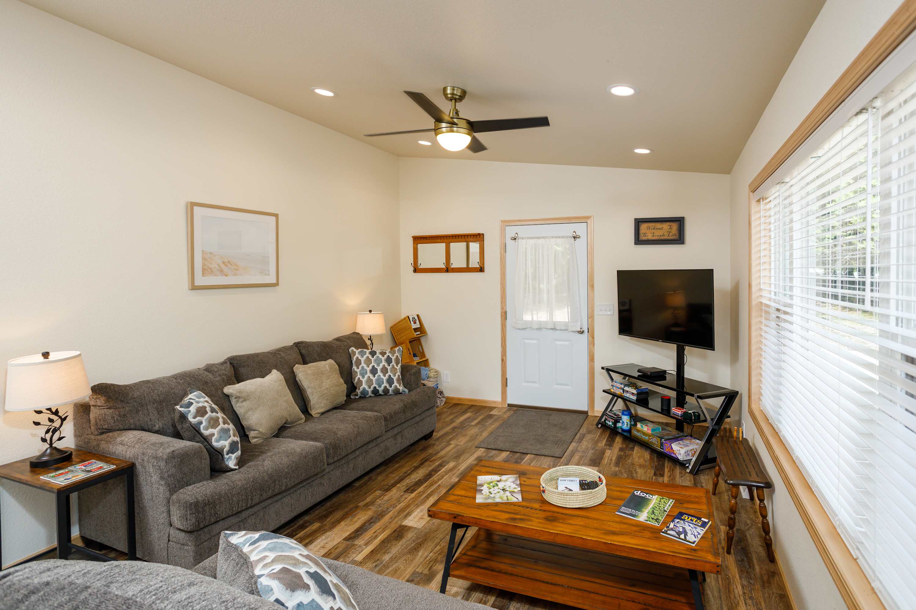Living room includes Smart TV, DVD player, two couches (one pulls out to queen bed), coffee table, games & DVDs