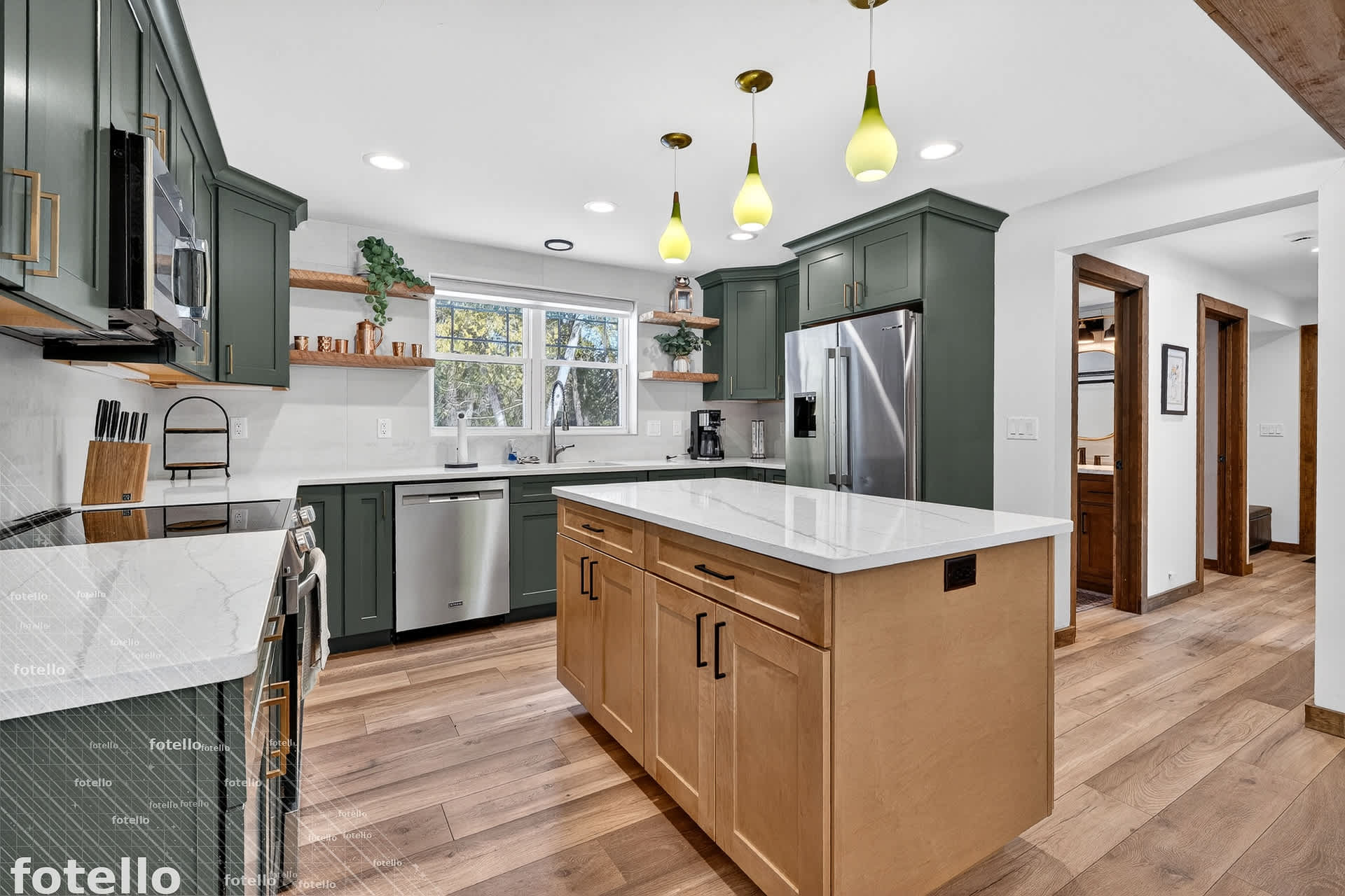 Your gourmet kitchen features modern appliances and elegant pendant lighting, perfect for preparing memorable meals during your stay.