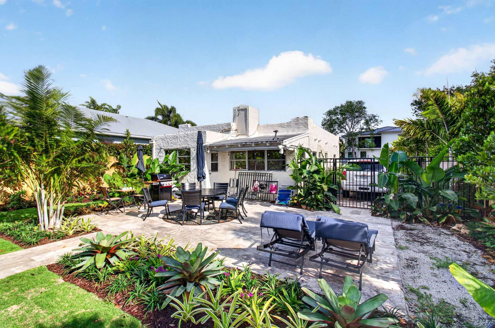 Lounge the day away or dine alfresco in the spacious back yard oasis​