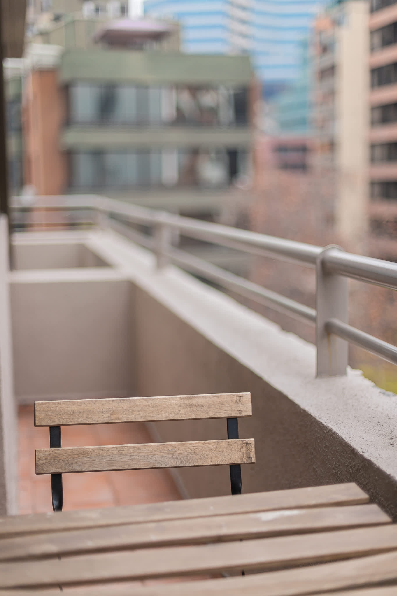 Enjoy a morning coffee on your private balcony with urban views.