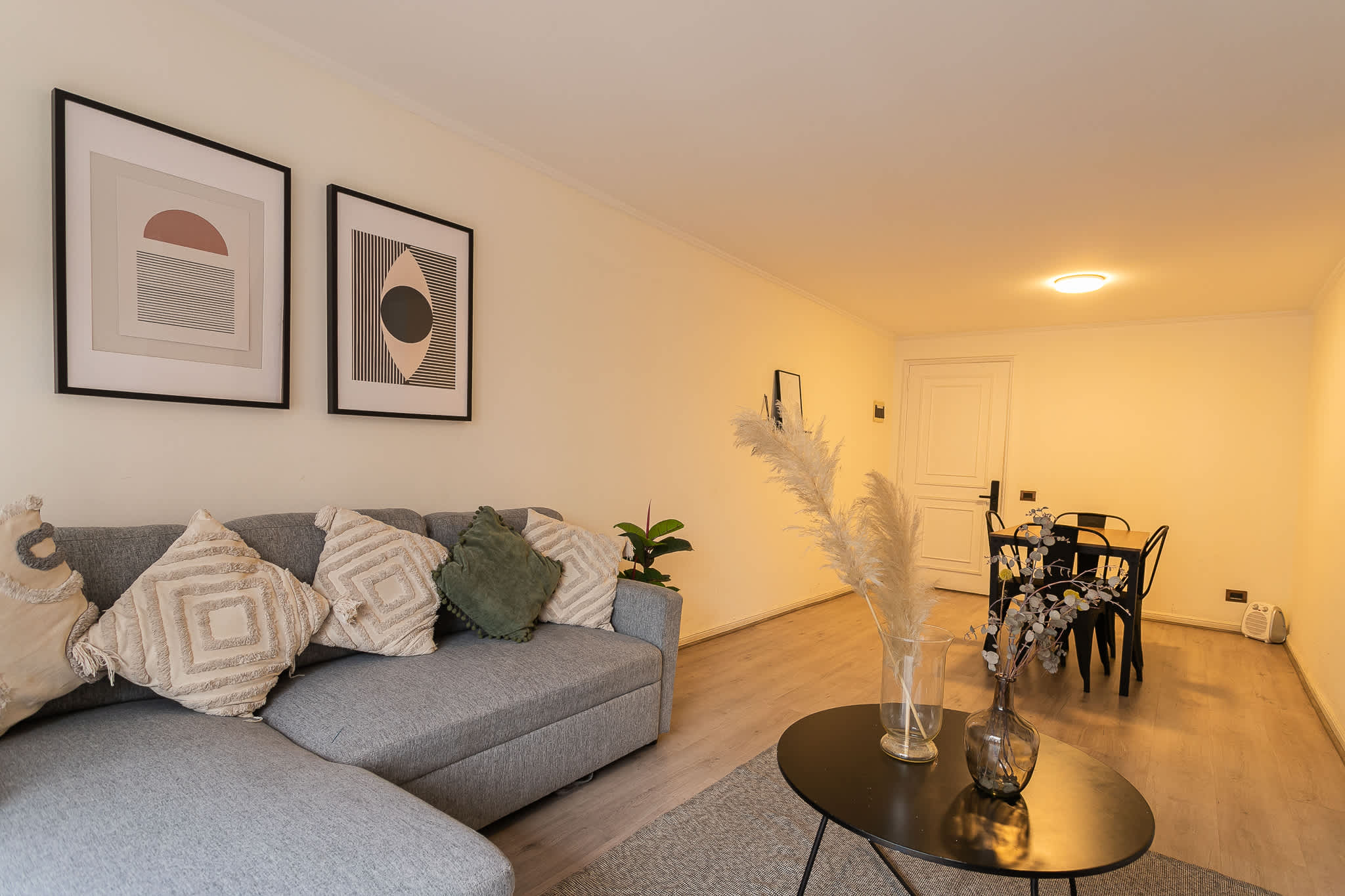 Relax in this stylish living area with modern decor and a cozy sofa, perfect for unwinding after a day of exploring.