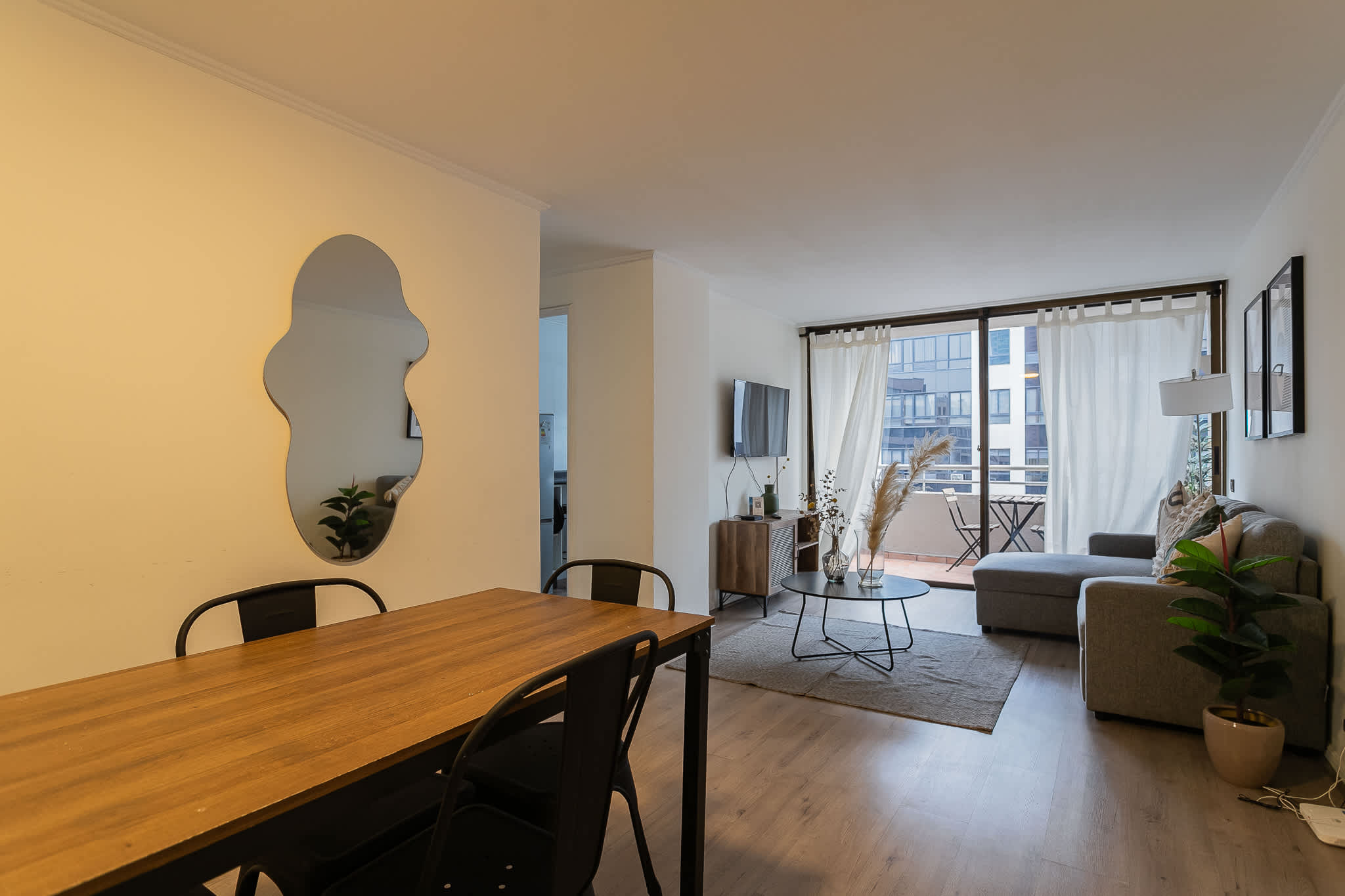 Bright and modern living space with cozy seating and stylish decor, perfect for relaxation.