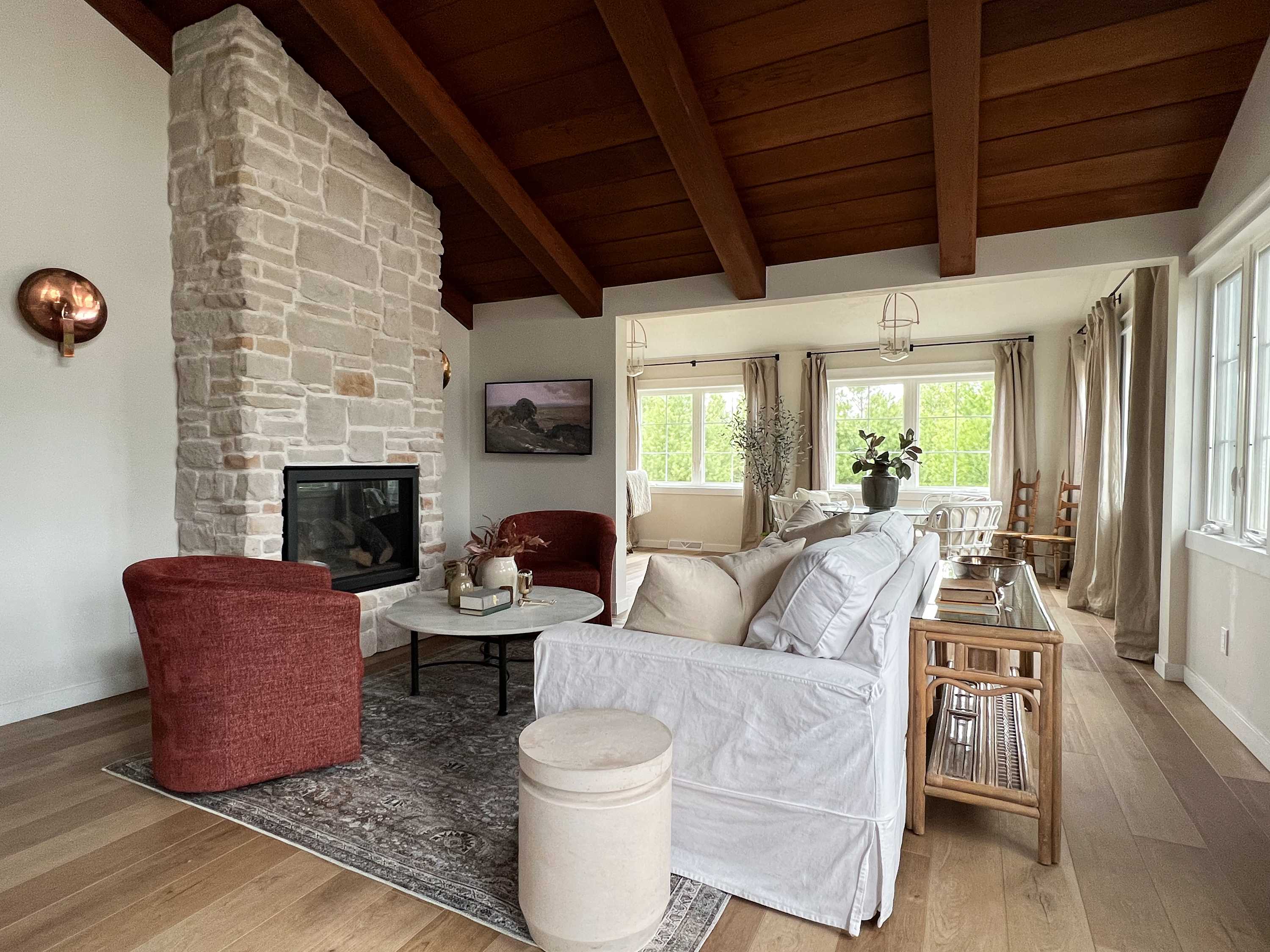 Main living space includes a Samsung Frame TV, gas fireplace and plenty of comfortable seating