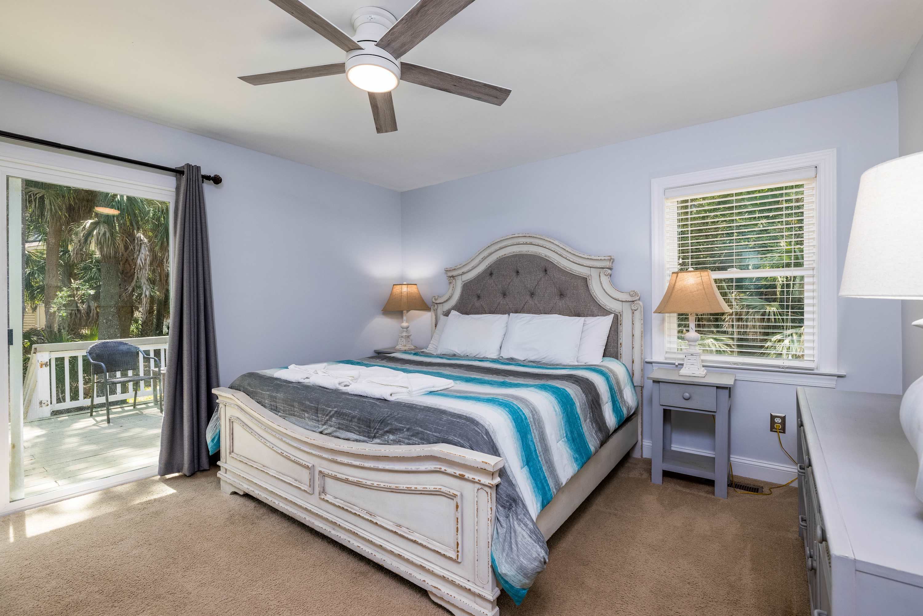 Primary Bedroom with King Bed and Full En Suite Bathroom with Access to Back Patio