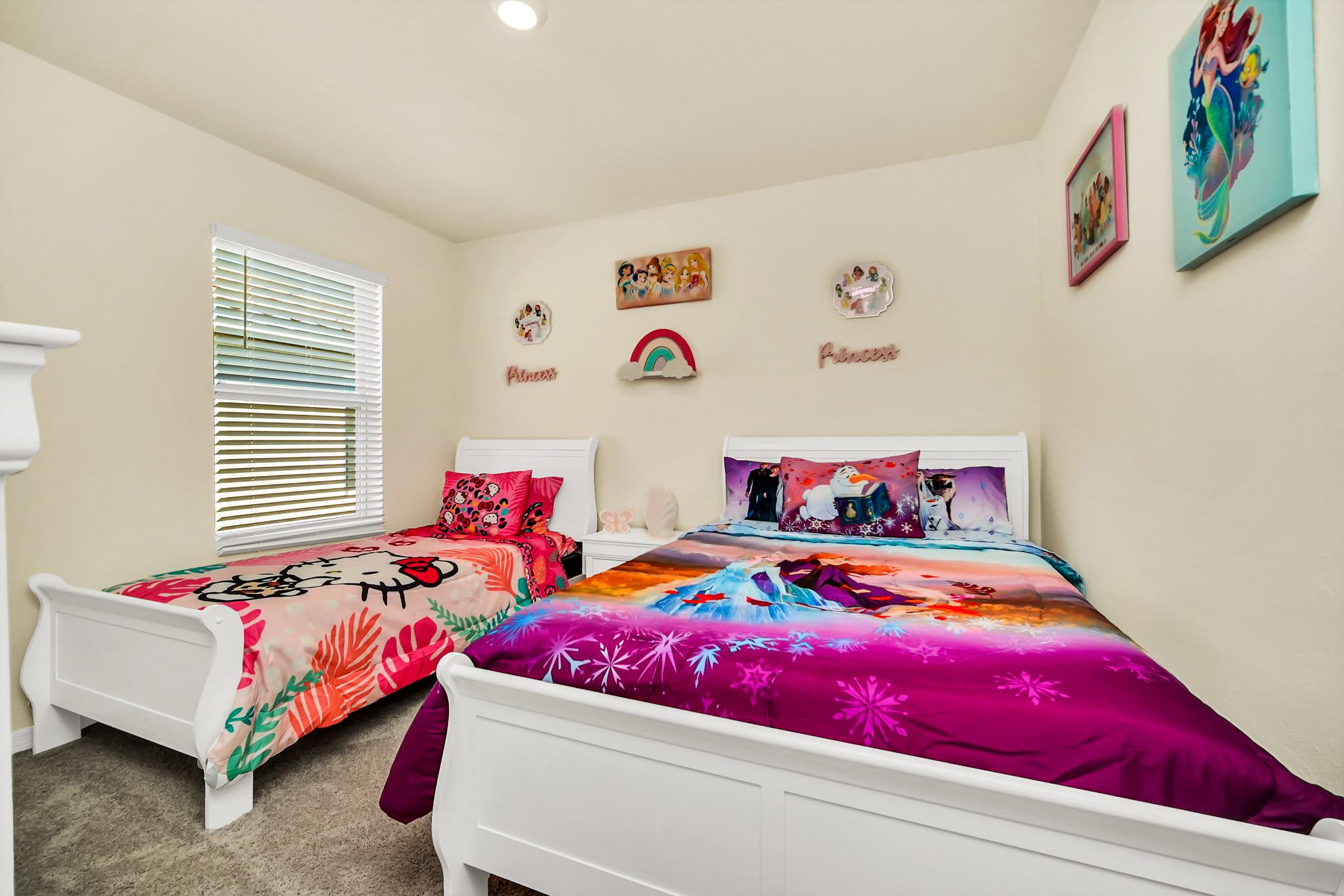 Delightful kids' room with vibrant character bedding and playful decor, perfect for a magical family stay.