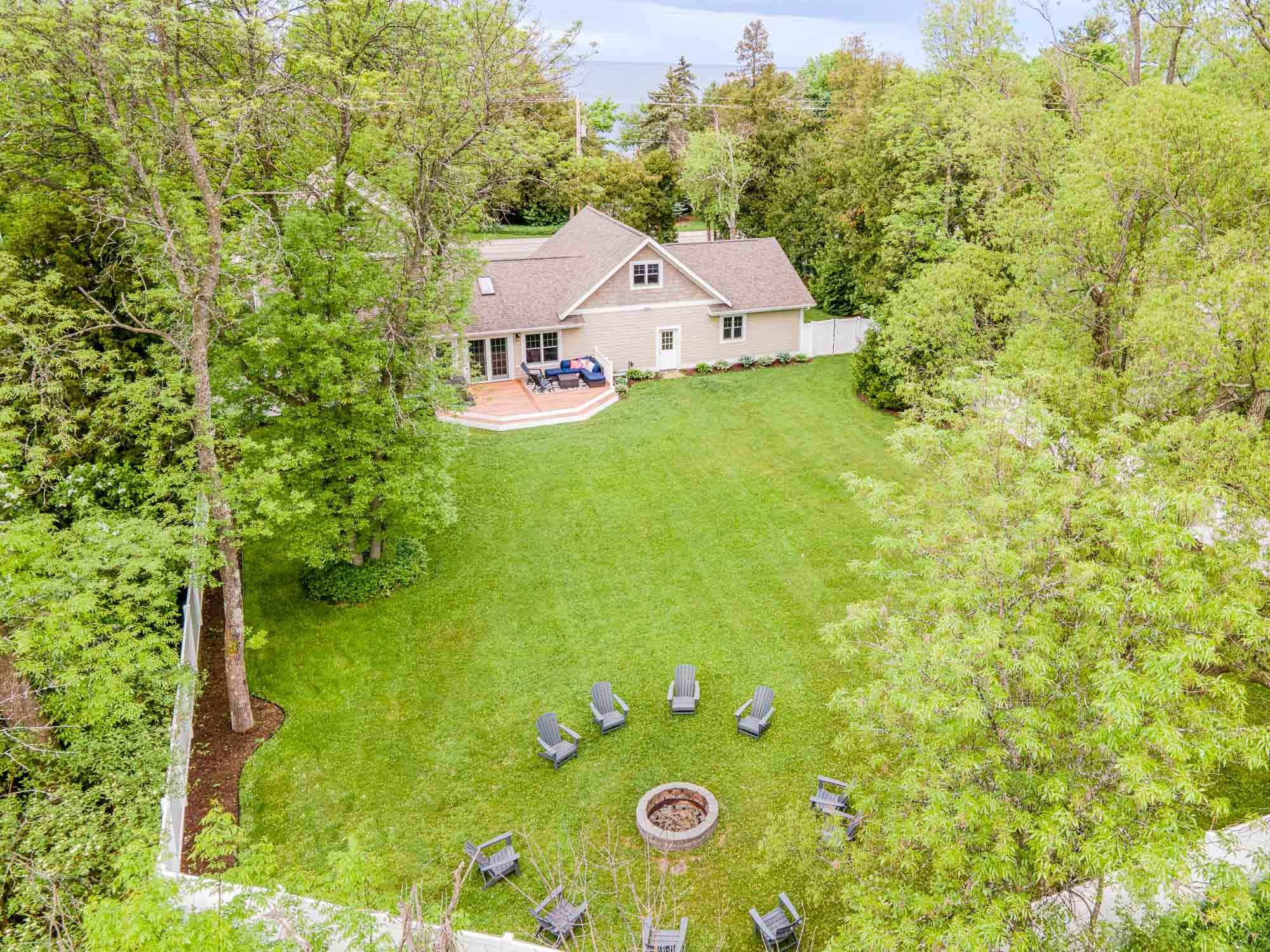 Lots of seating to enjoy the fire pit and a fenced in yard!