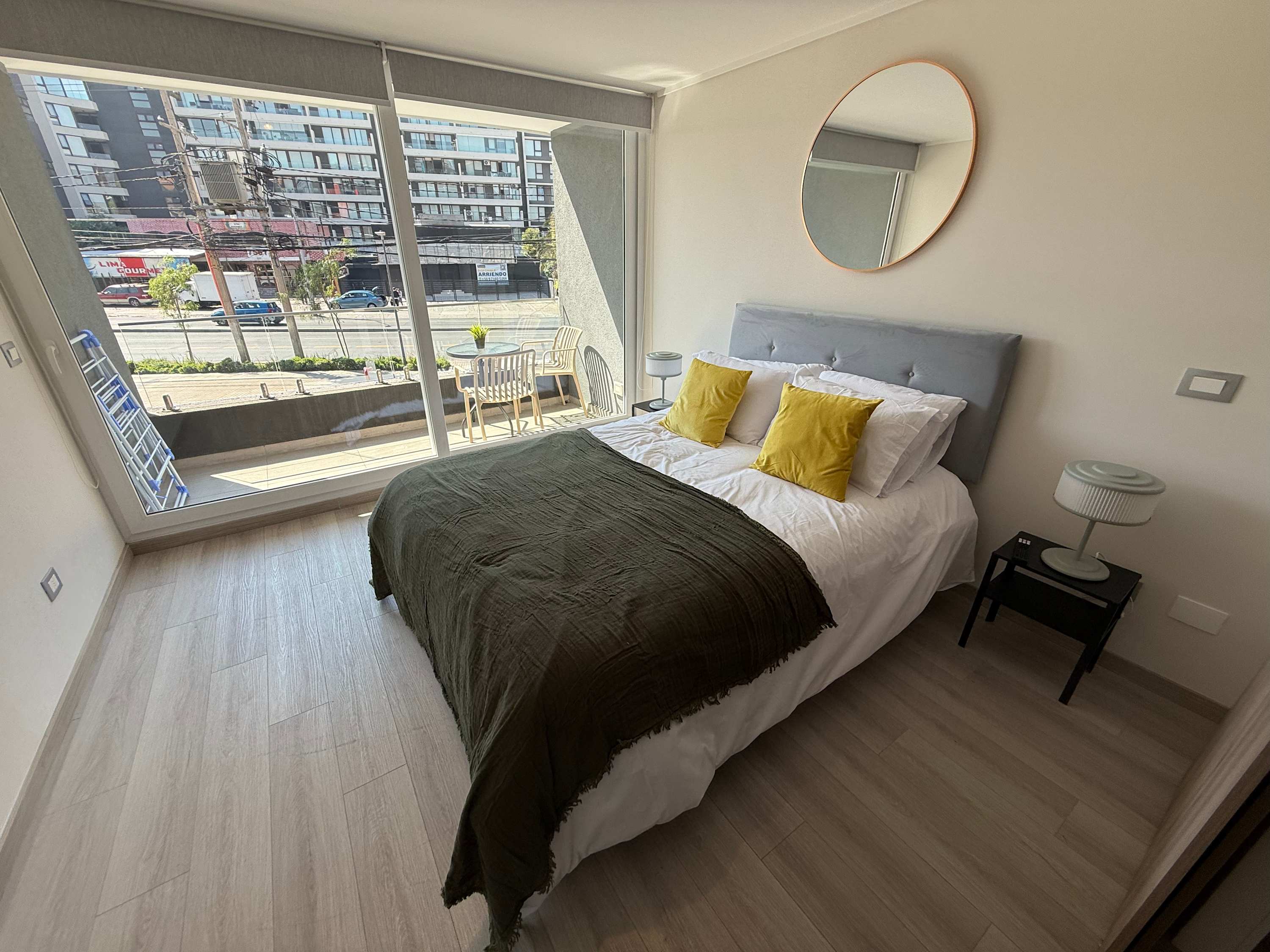 Relax in this cozy studio with a large window and balcony, perfect for enjoying city views and natural light.