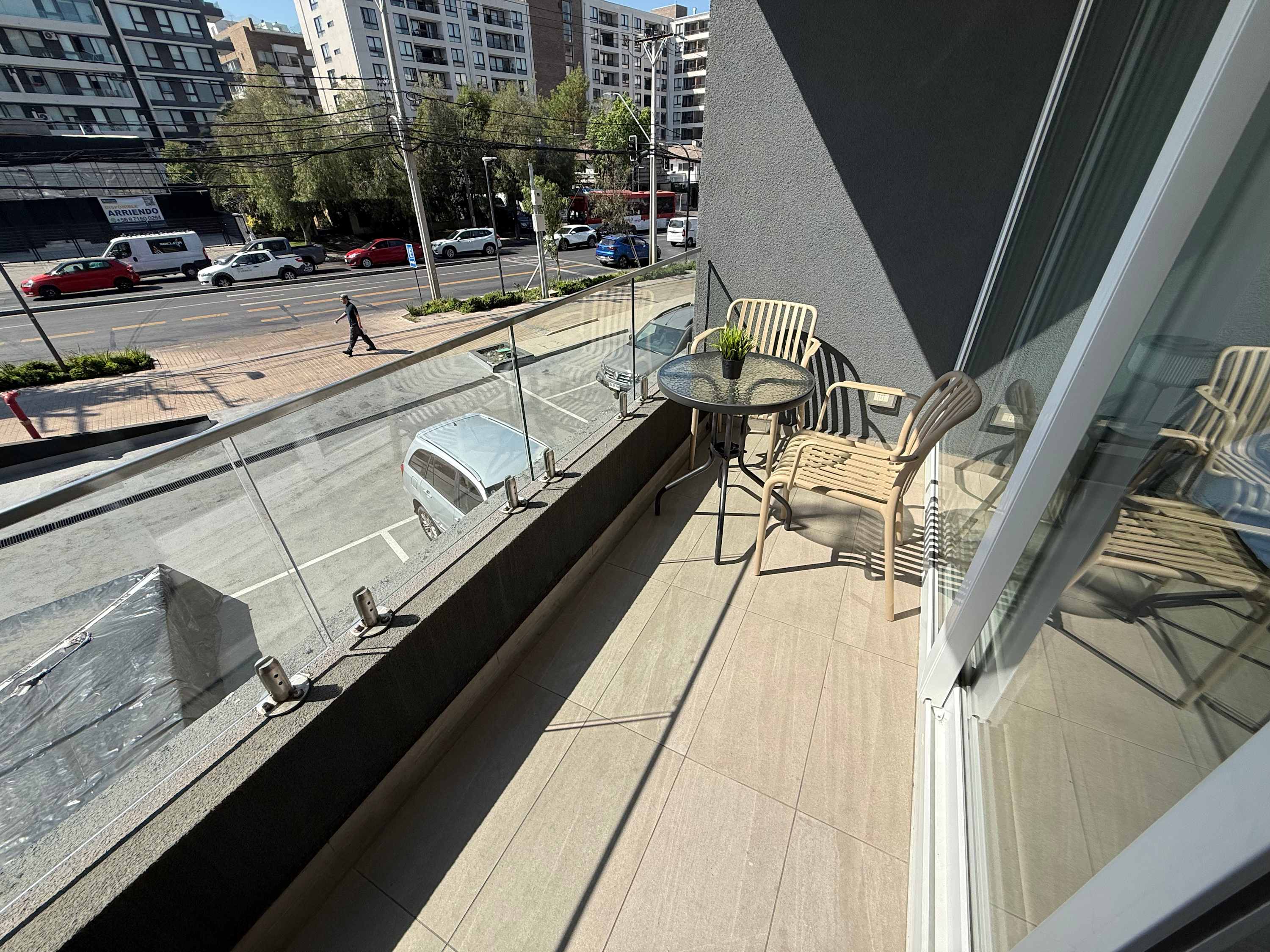 Enjoy a sunny morning coffee on your private balcony with city views.