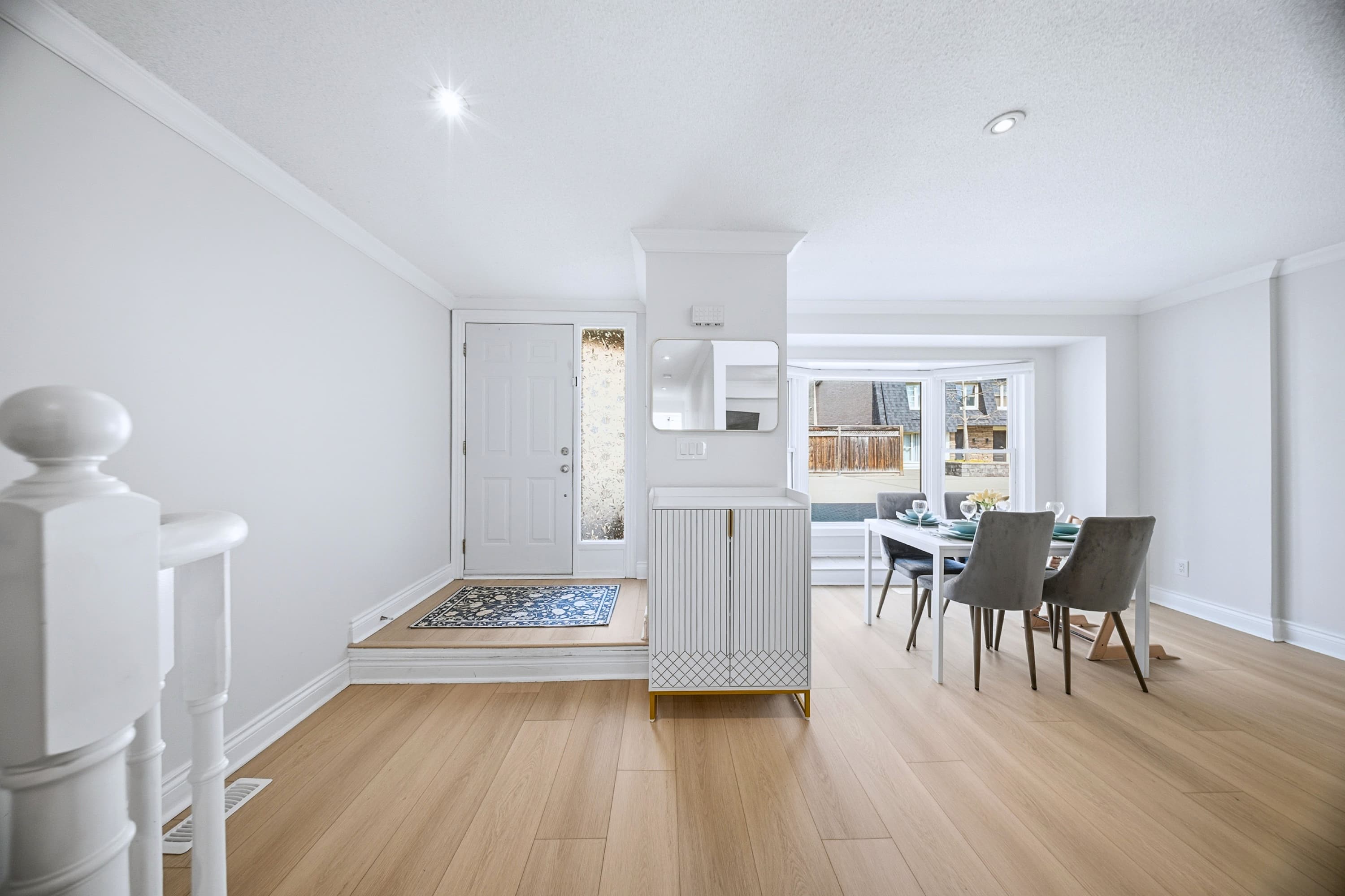 Sunlit dining space with outdoor views and an open feel