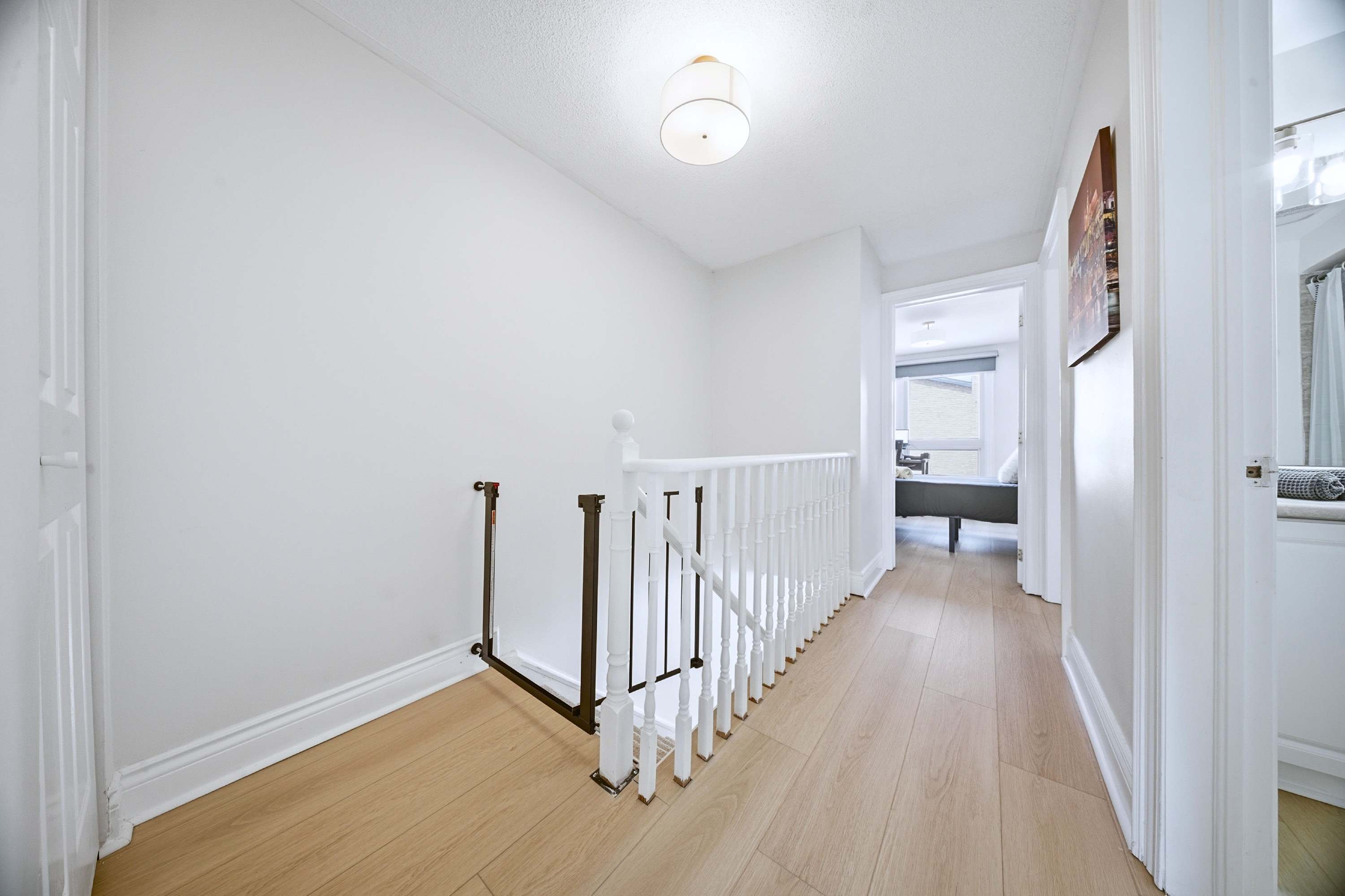 Stairs with a child safety gate for added security, designed with family safety in mind.