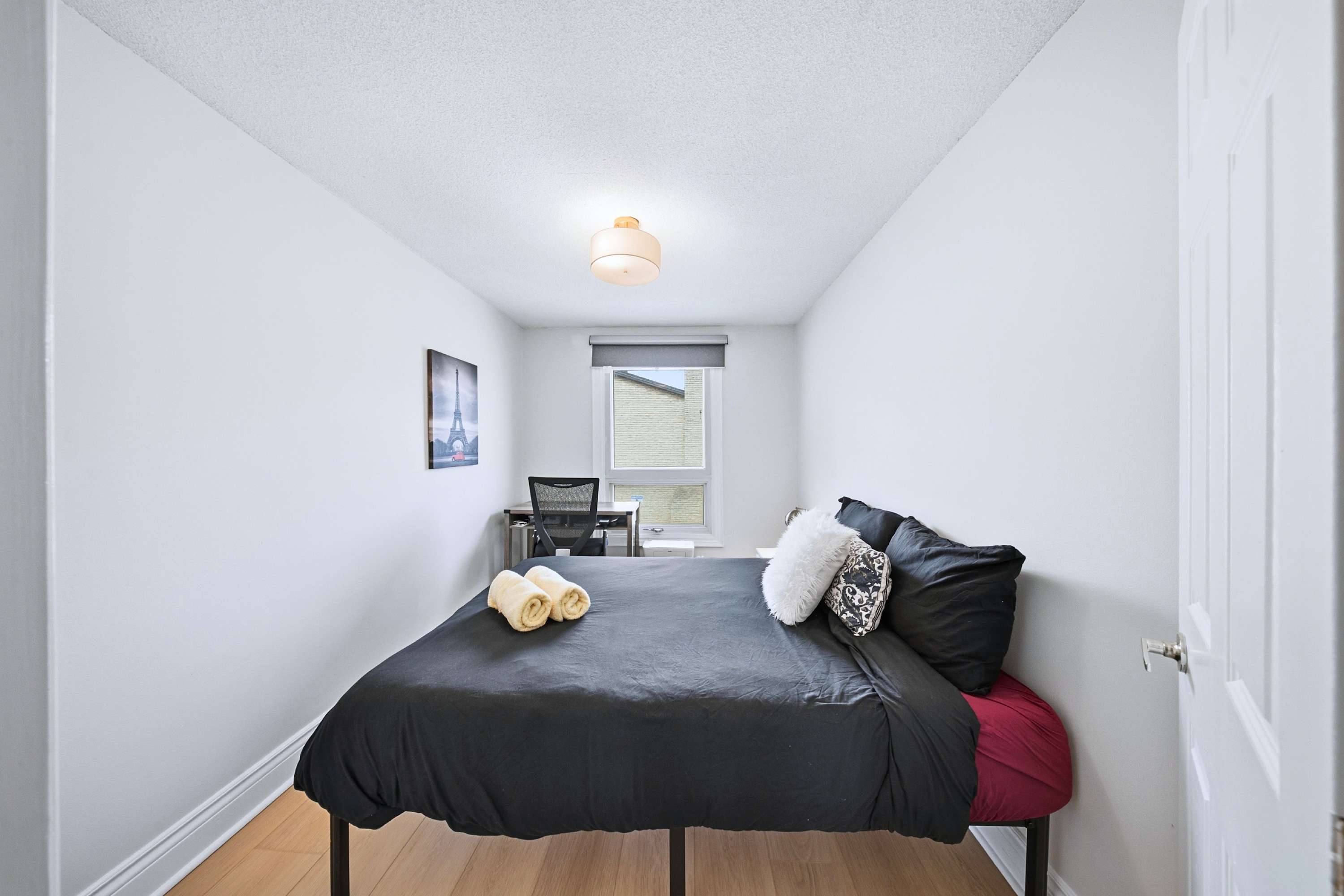 Cozy bed dressed with clean bedding for quality sleep