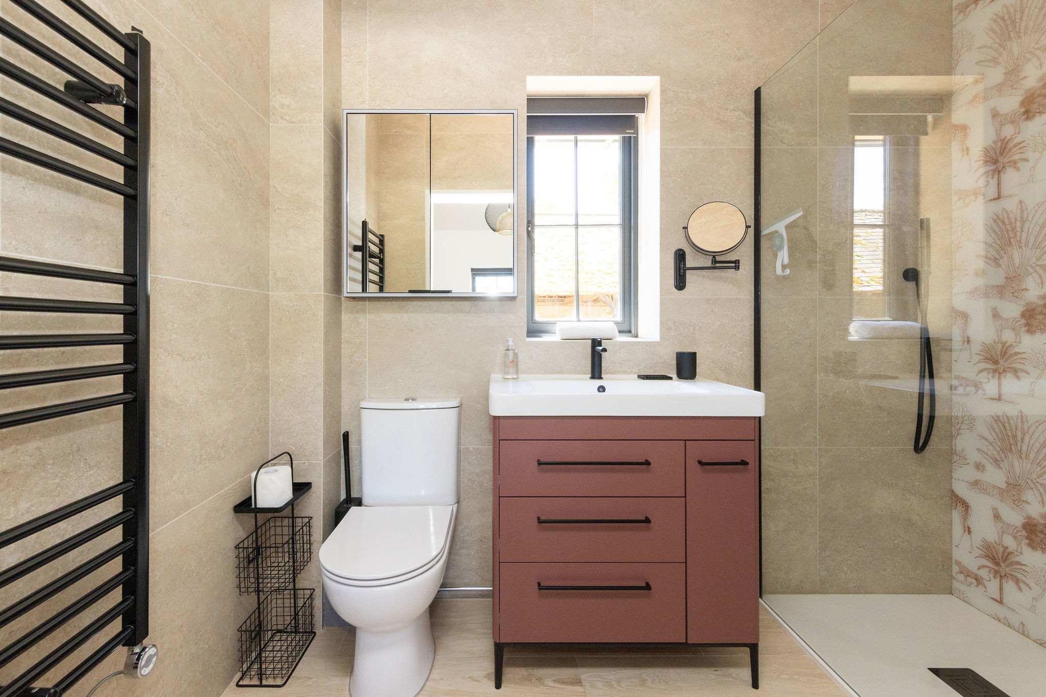 Refresh in a modern bathroom with walk-in shower, earthy tones, and simple Sussex countryside comfort.
