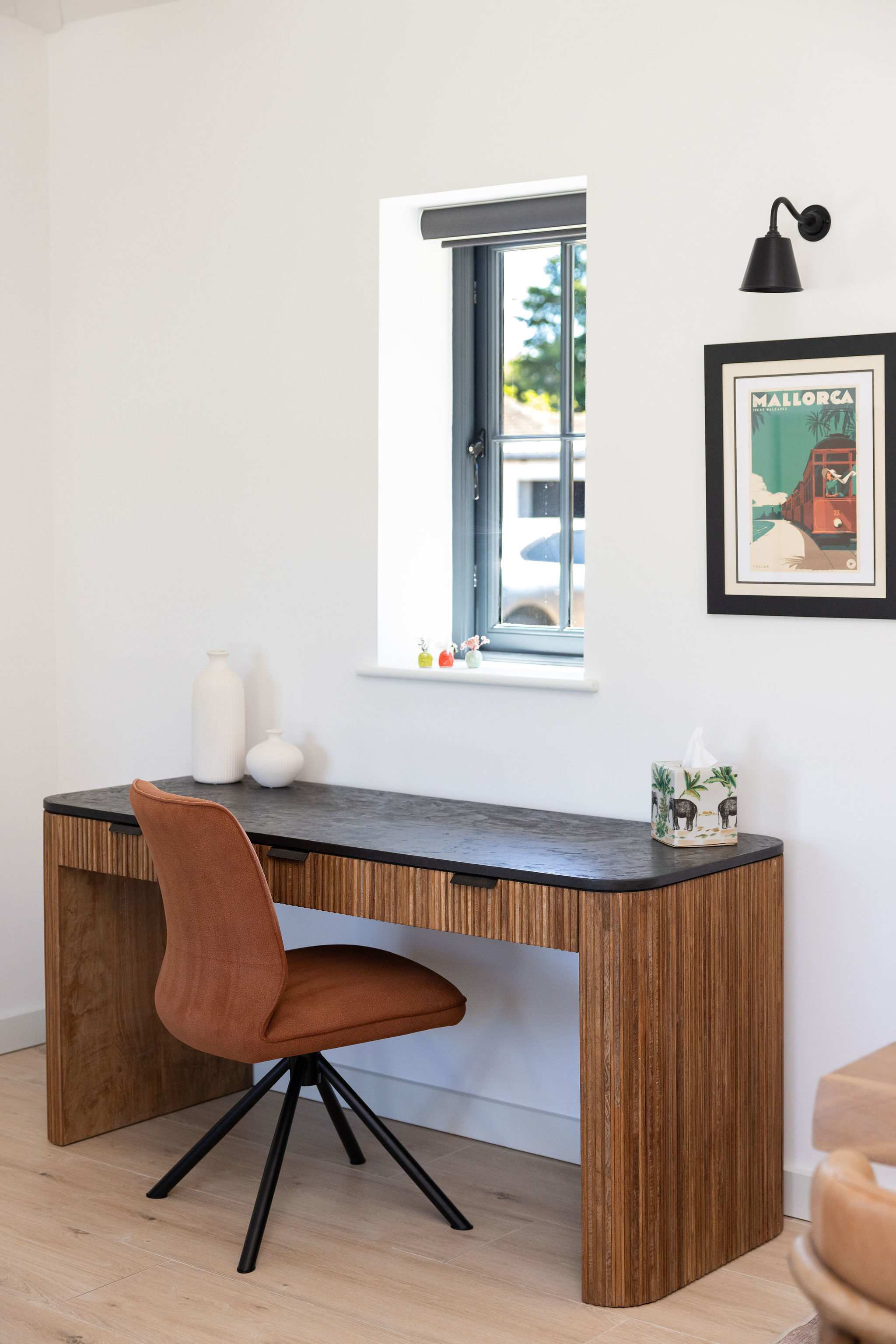 Work or write peacefully at a dedicated desk, with natural light and relaxed lodge comfort nearby.
