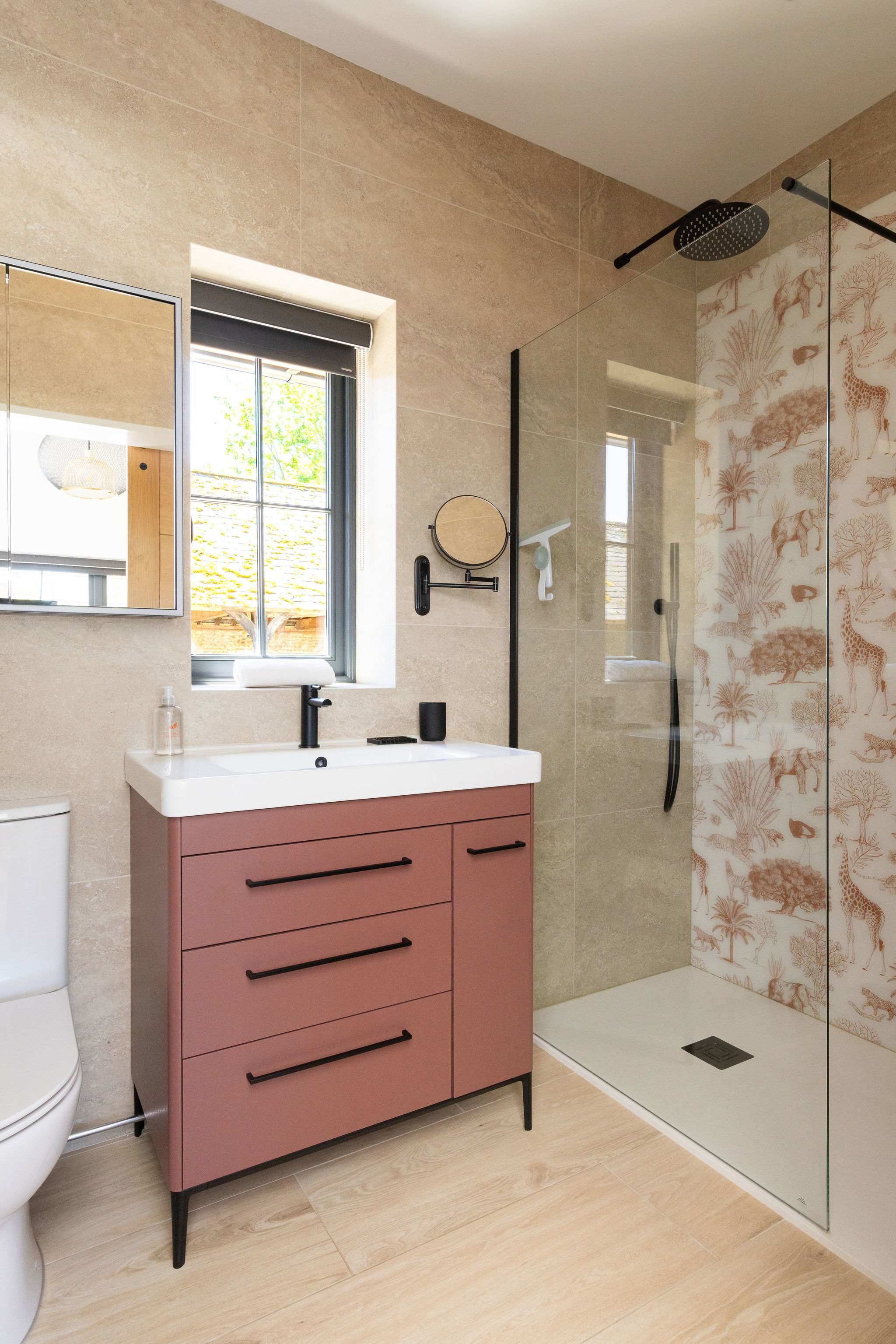 Refresh in a warm modern bathroom with walk-in shower, soft textures, and relaxed countryside lodge style.
