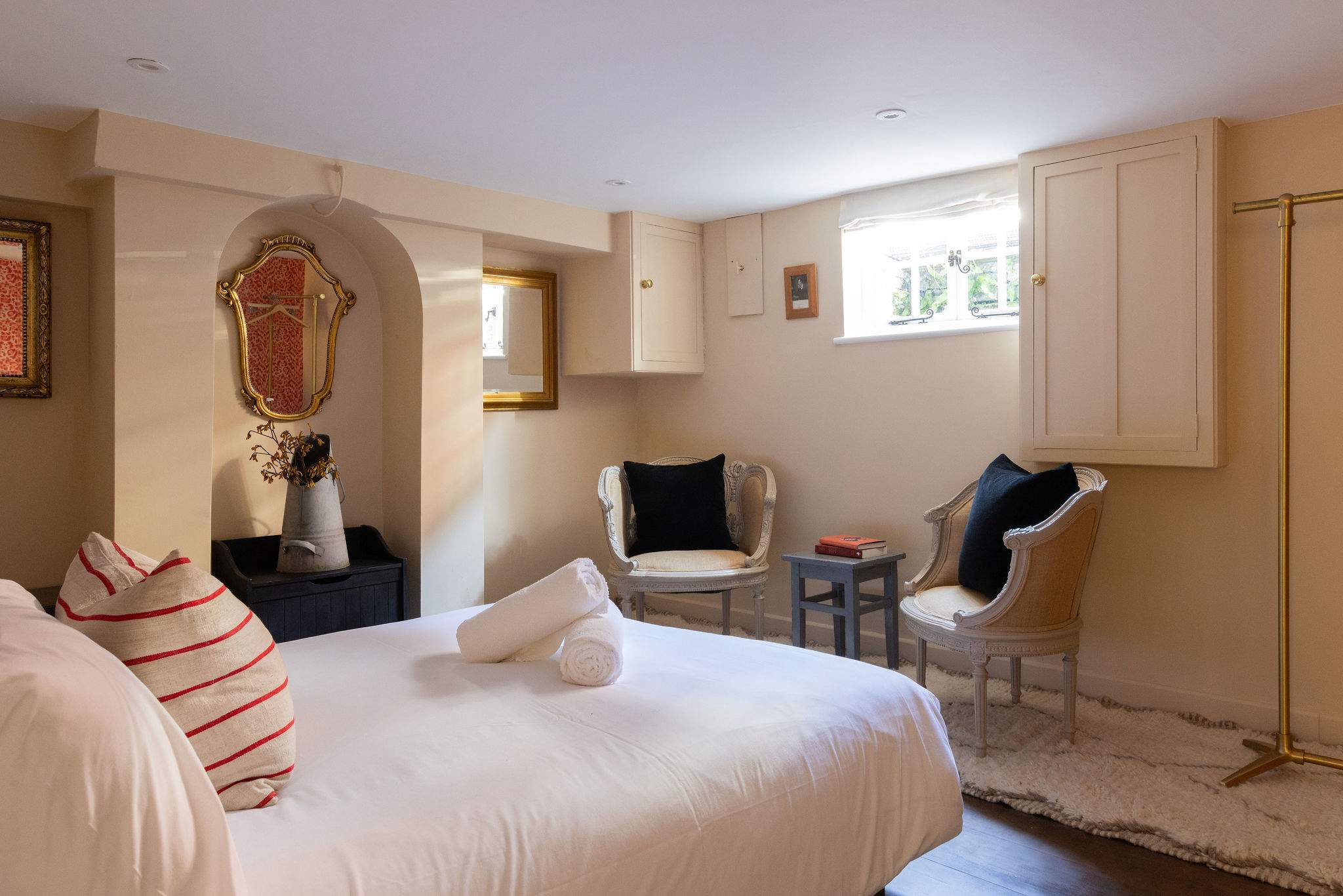 Beautifully styled basement bedroom with boutique hotel feel