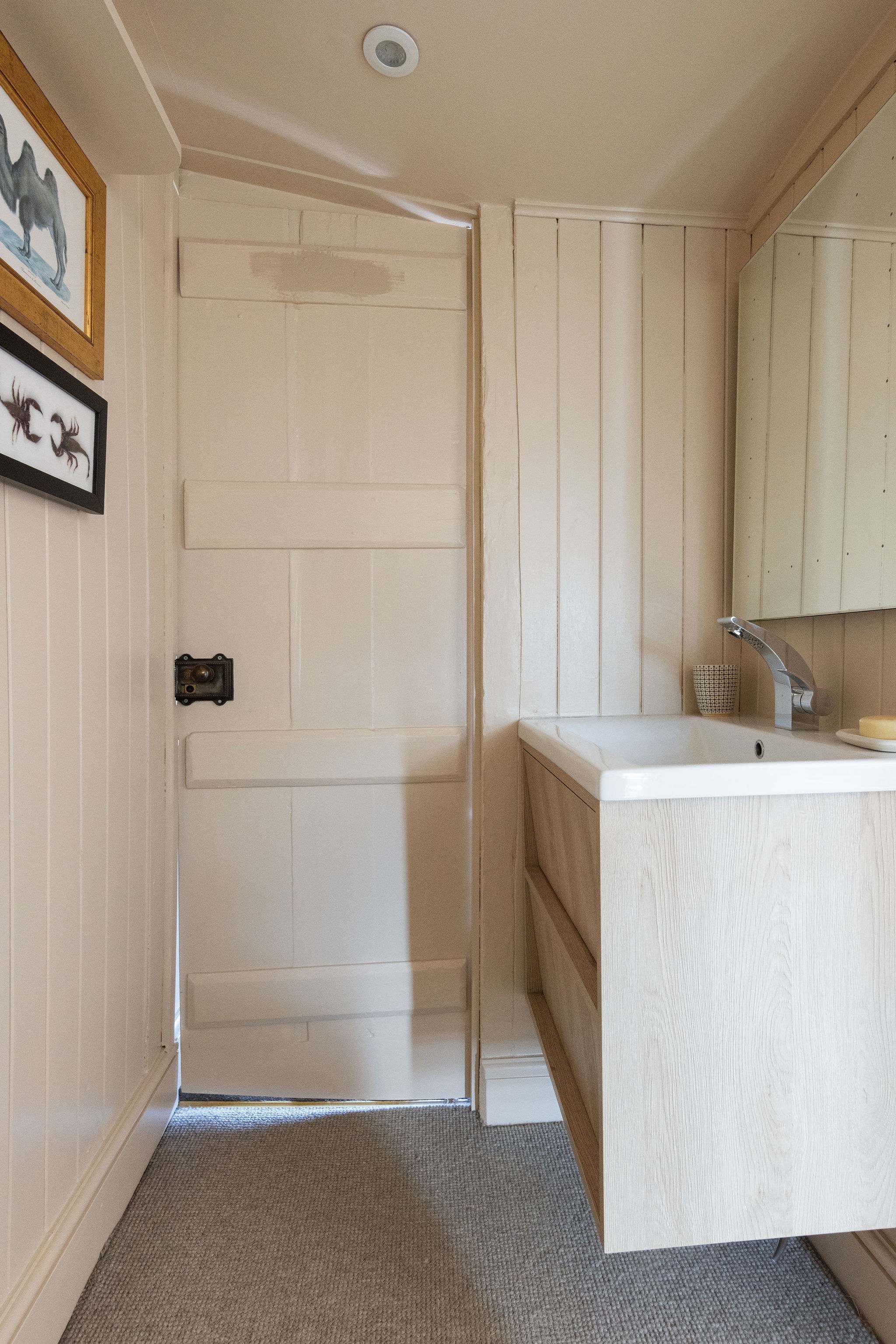 Modern jack and jill cloakroom with stylish vanity and sleek finish